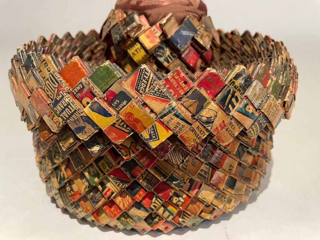 Wonderful and whimsical tramp art sewing box made with old matchbooks. The colorful geometric patterns make this a compelling and just plain fun piece of folk art. Cloth top for holding needles and pins. Imagine all the time, effort and talent that