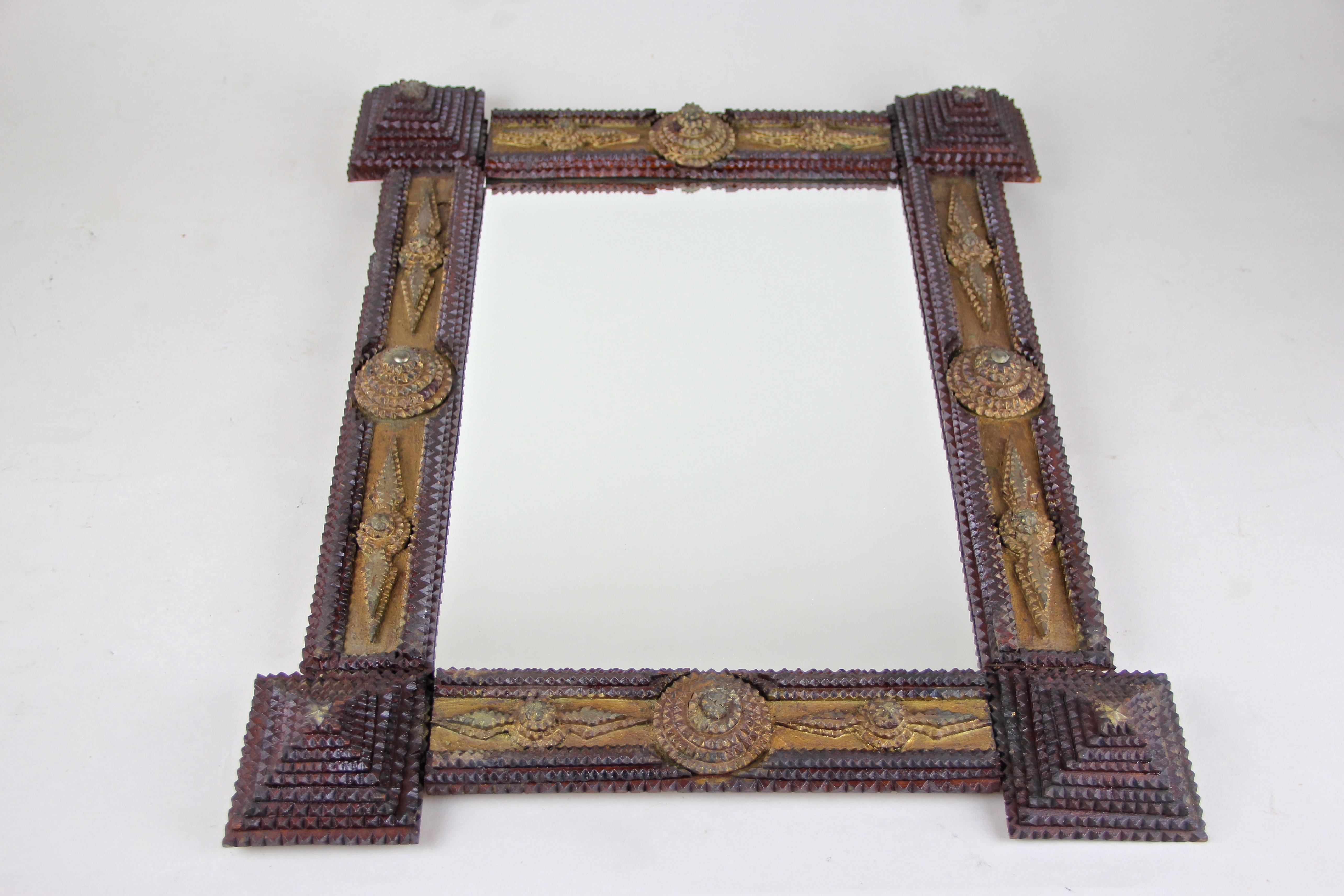 Remarkable tramp art mirror from Austria coming from the 19th century. Built from fine hand carved basswood this fantastic work from circa 1860 was done in the so called 