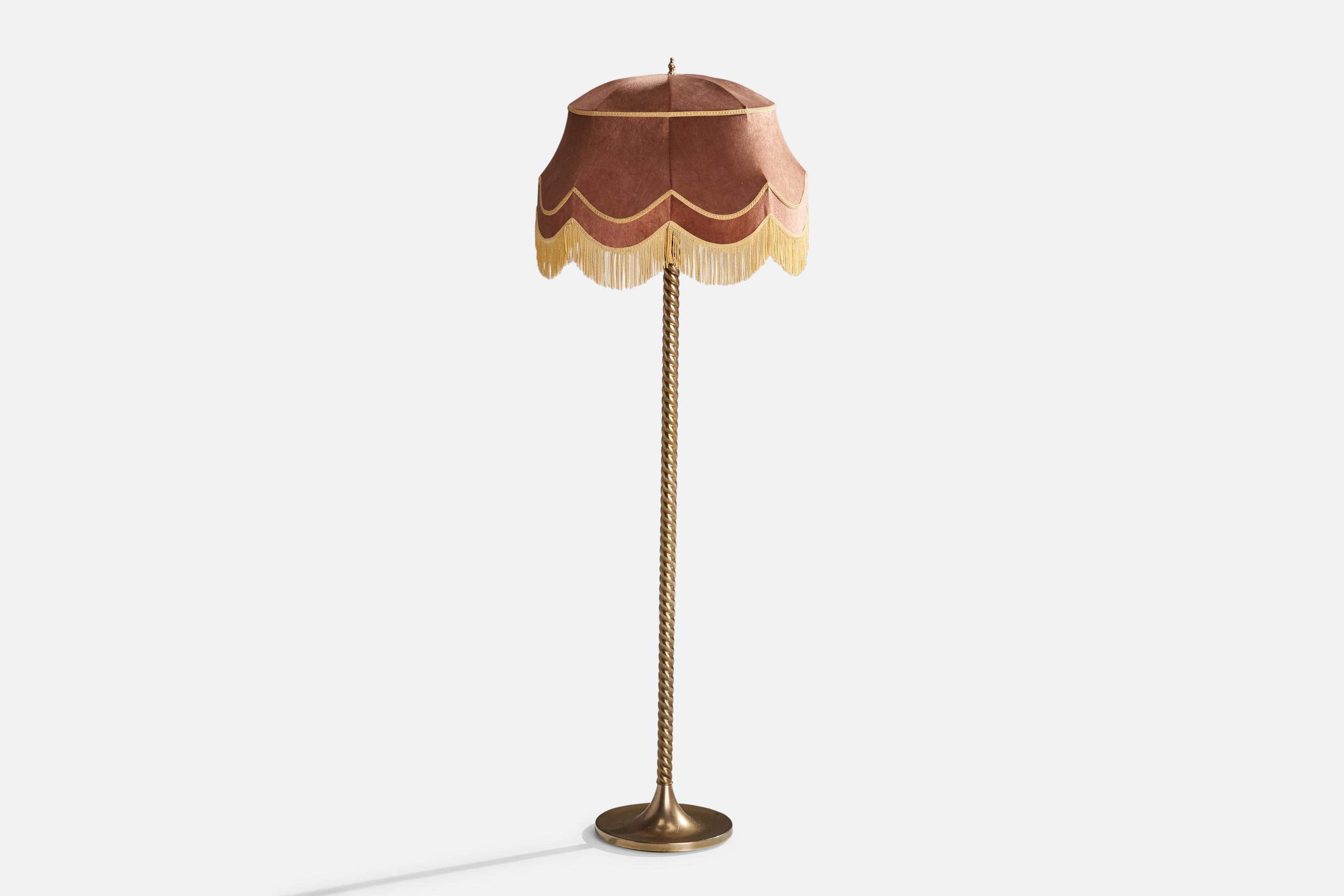 A brass, pink velvet and beige string fabric floor lamp designed and produced by Tranås Stilarmatur, Sweden, c. 1970s.

Vintage lampshade in fair condition.

Overall Dimensions (inches): 59.5” H x 19.25” W x 19.25” D
Stated dimensions include