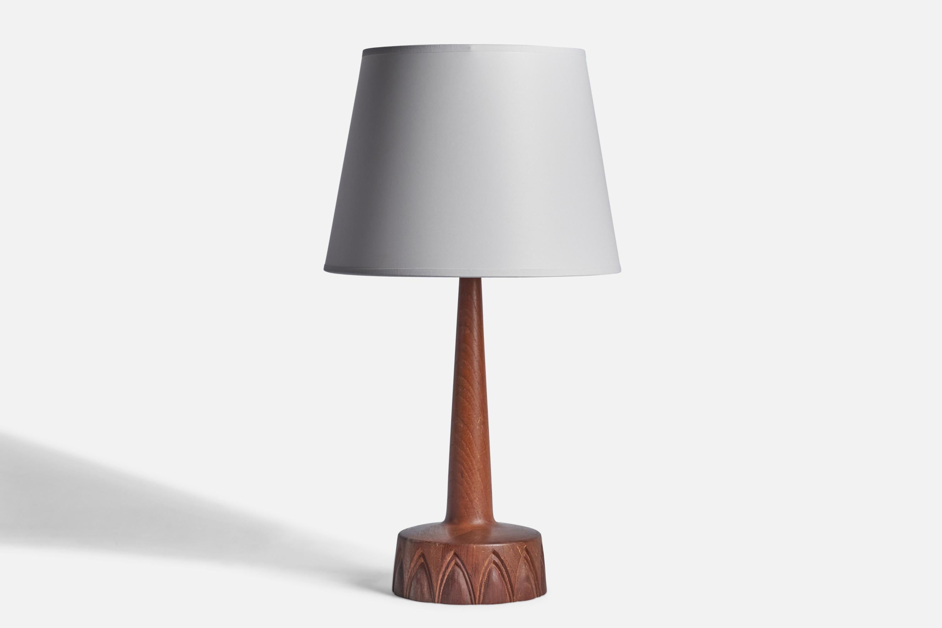A teak table lamp designed and produced by Tranås Stilarmatur, Sweden, 1960s.

“523” stamp on bottom
Dimensions of Lamp (inches): 17” H x 6.25” Diameter
Dimensions of Shade (inches): 9” Top Diameter x 12” Bottom Diameter x 9” H 
Dimensions of Lamp