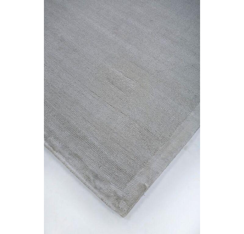 What if your floor could whisper elegance and sophistication with every step? The Modern style hand-loom rug by encapsulates simplicity, elegance, and lucidity in its design. Crafted meticulously by master artisans, this rug in London fog, with a