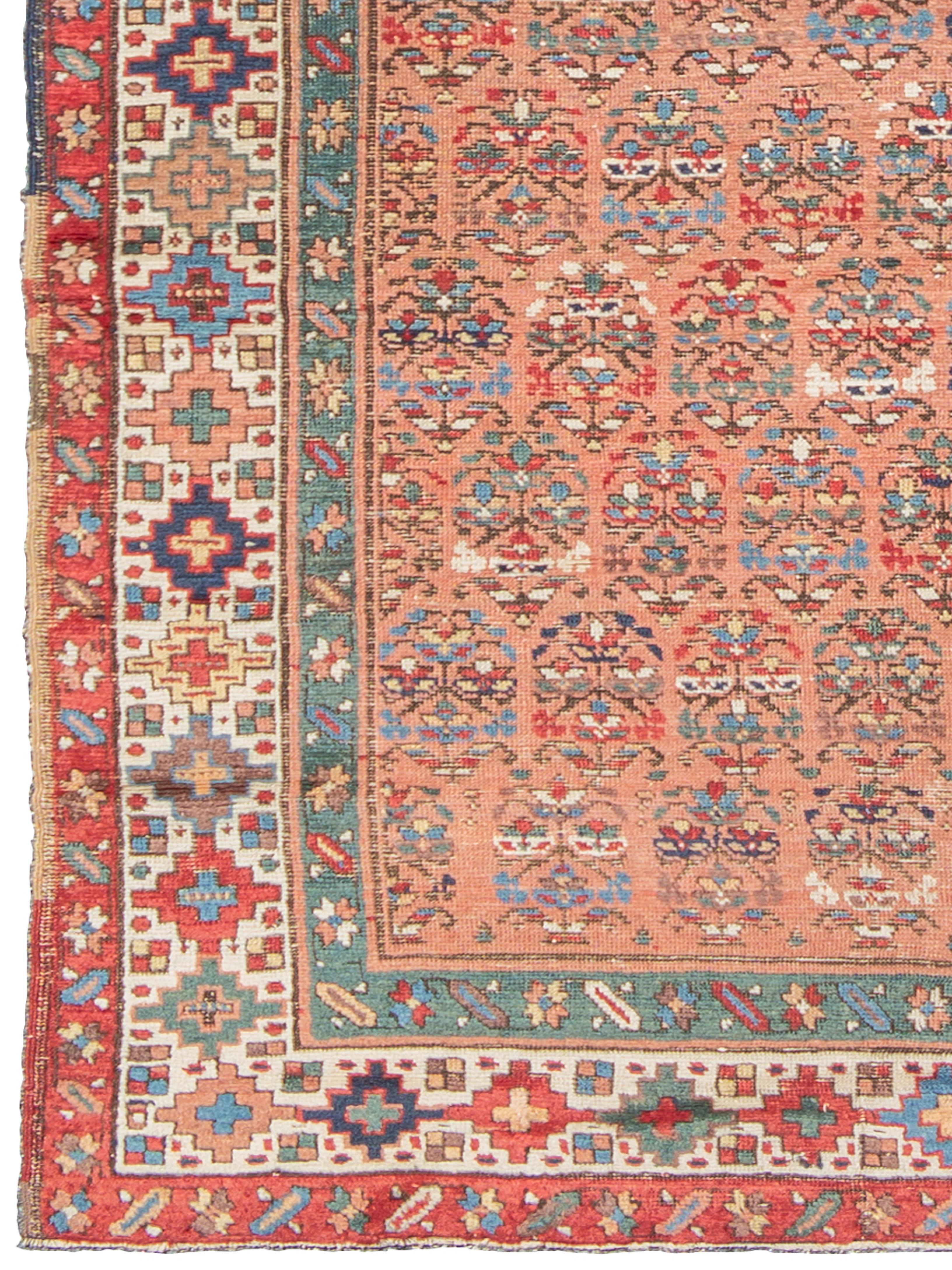 Antique Transcaucasian runner, Late 19th Century

This late 19th-century Transcaucasian runner is a fine example of tribal weaving, featuring a complex, all-over geometric pattern set against a patinaed pomegranate-red field. The rug is framed by a
