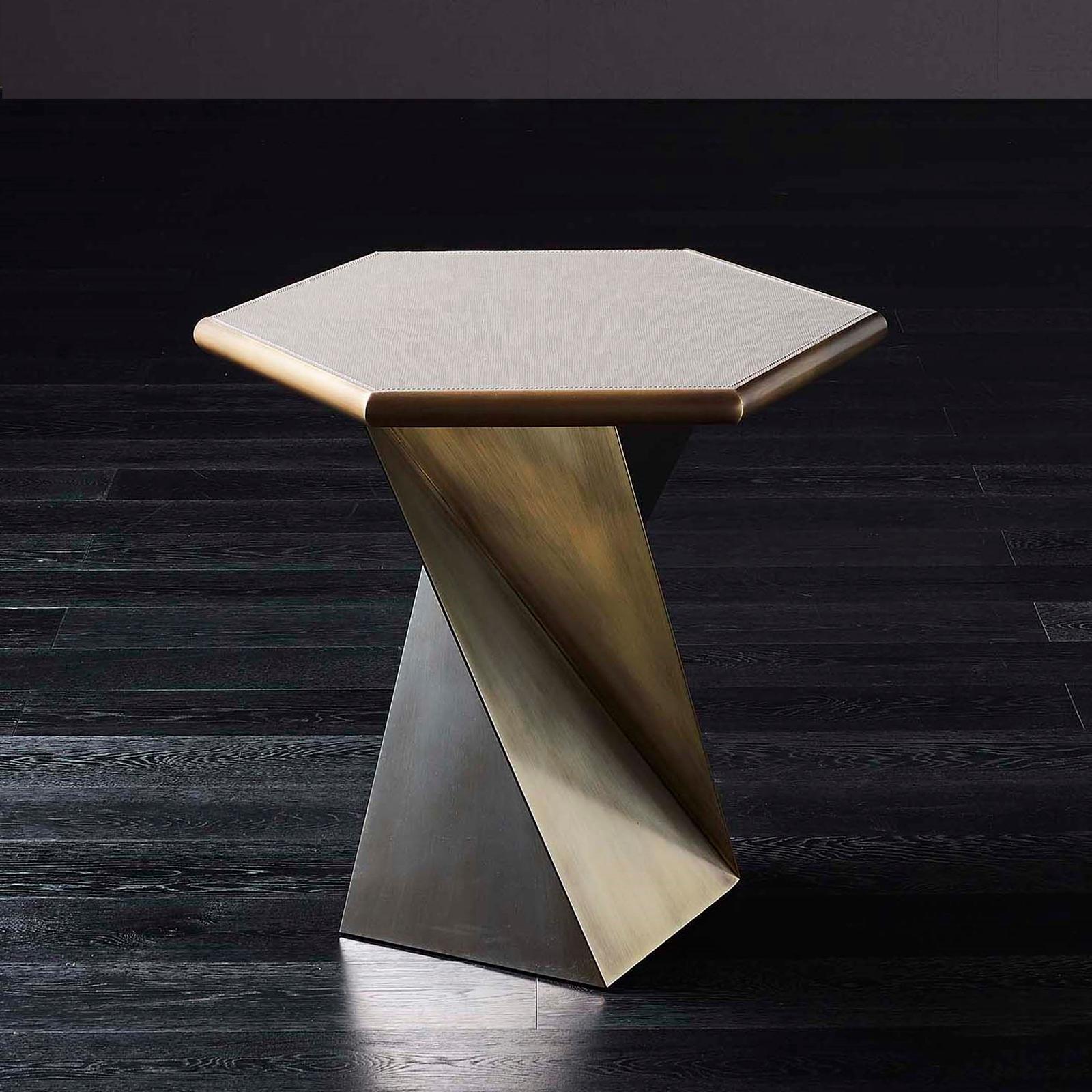 Side table with solid bronze base and structure.
Top in solid bronze covered with natural genuine
leather. Price: 6500,00€
Also available with marble top, price: 8400,00€.
     