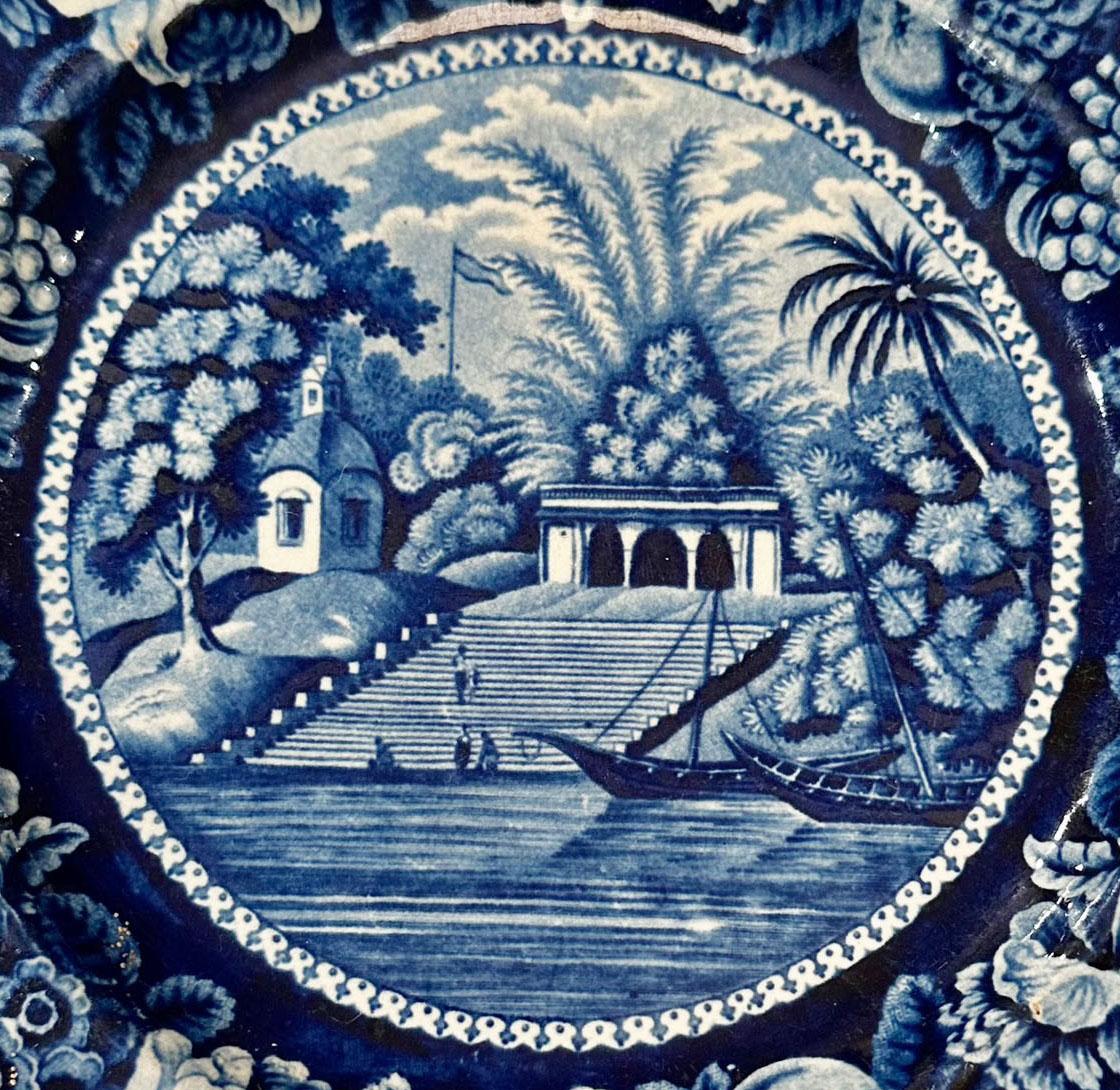 An early antique blue and white transfer ware plate by Staffordshire. Stamp on reverse. England, circa 1828.