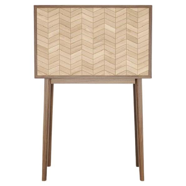 Crafted with the dynamic needs of evolving individuals and spaces in mind, this piece shines with its adaptability and personalized touch. Its interior offers complete rearrangement options, transforming it effortlessly into a bar, a desk, or a