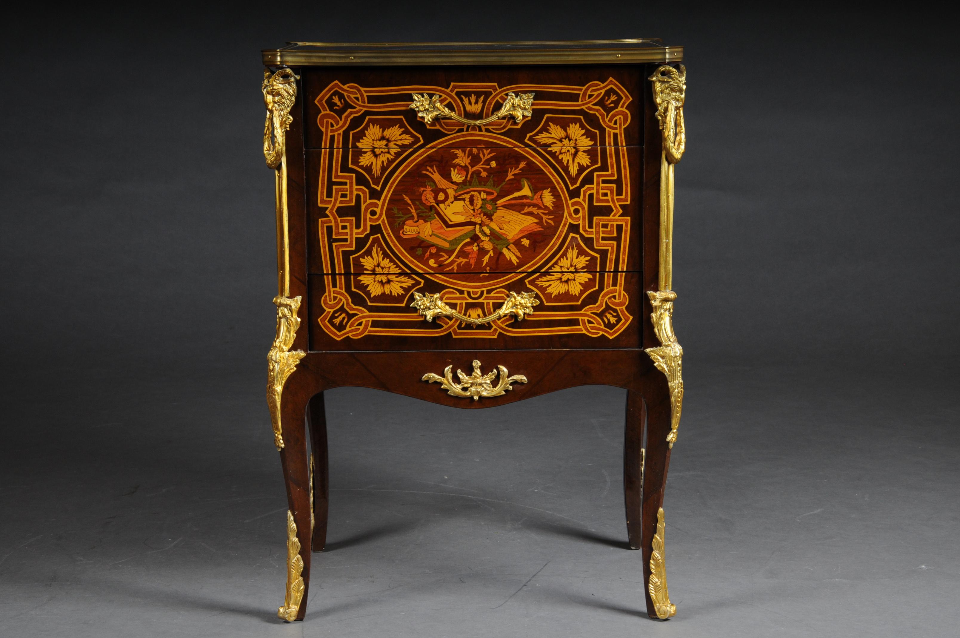 Transition side table chest of drawers Napoleon III marquetry

Bois-Satiné veneer, all-round mirror veneer and marquetry on beech wood. Set with finely chased, very decorative, pierced bronze fittings edged. Carcase box on sloping, curly legs ending