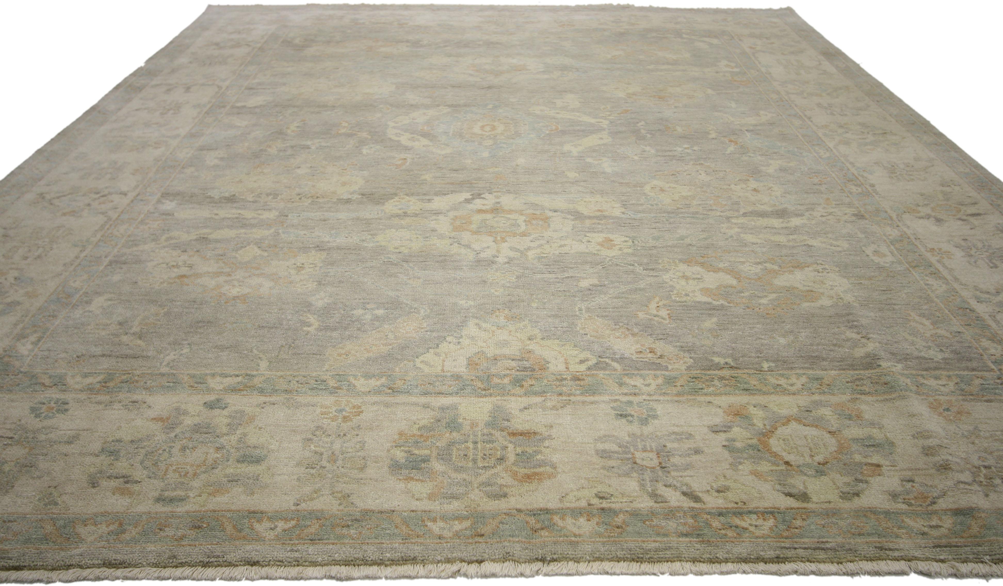 30052 transitional area rug with Oushak design and soft colors. From traditional decor to transitional style and even a family's casual lifestyle, create a welcoming room with this modern Oushak style rug. Impeccably woven from hand knotted wool and