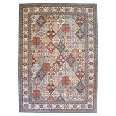 Tapis persan Bakhtiari en laine tribale, crème, bleu, orange, rouge, 10' x 13'.