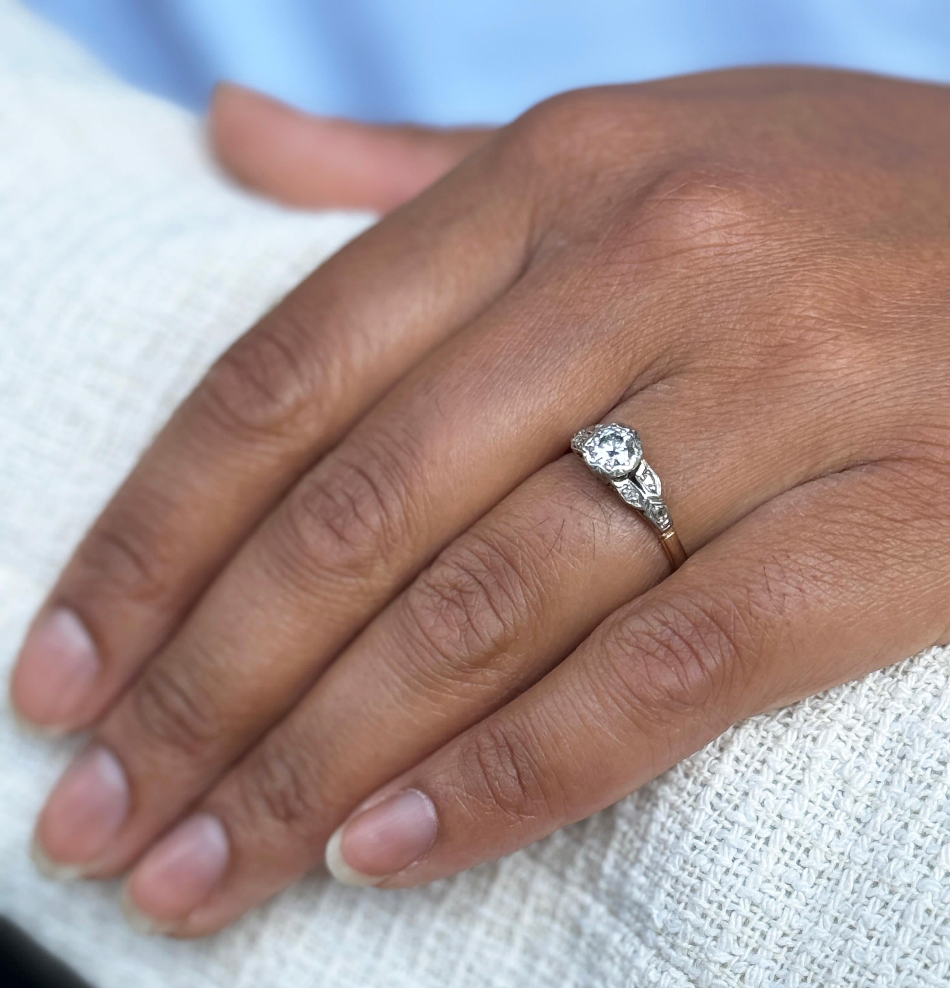 Step back in time with this charming vintage engagement ring, dating to the 1950s, masterfully crafted from 18 carat yellow gold and platinum.

The stunning piece is centred by a wonderful transitional cut diamond, with an approximate weight of