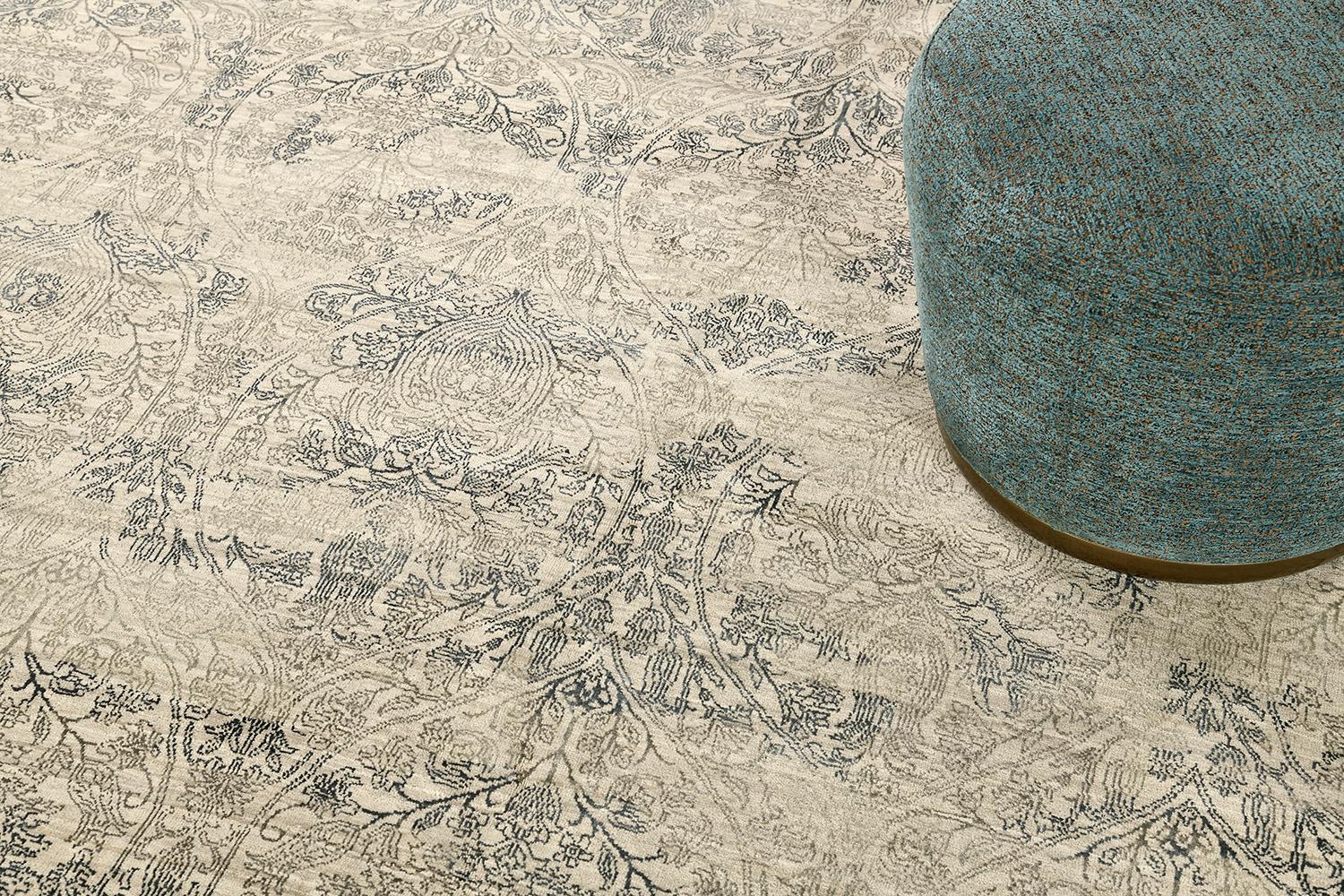 This unique transitional design from the Allure collection is the epitome of elegance and refinement. A wool pile weave that intricately weaves over a silver ground with grey and teal silk detailing that brings classical floral motifs into