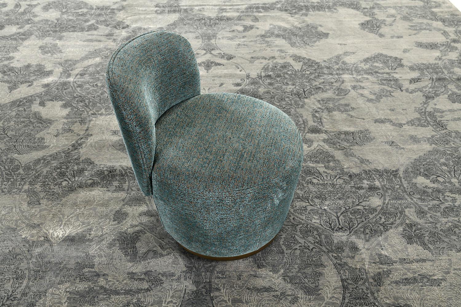 This unique transitional design from the Allure collection is the epitome of elegance and refinement. A wool pile weave that intricately weaves over a silver ground with glistening teal motifs and ivory accents. A contemporary interpretation of