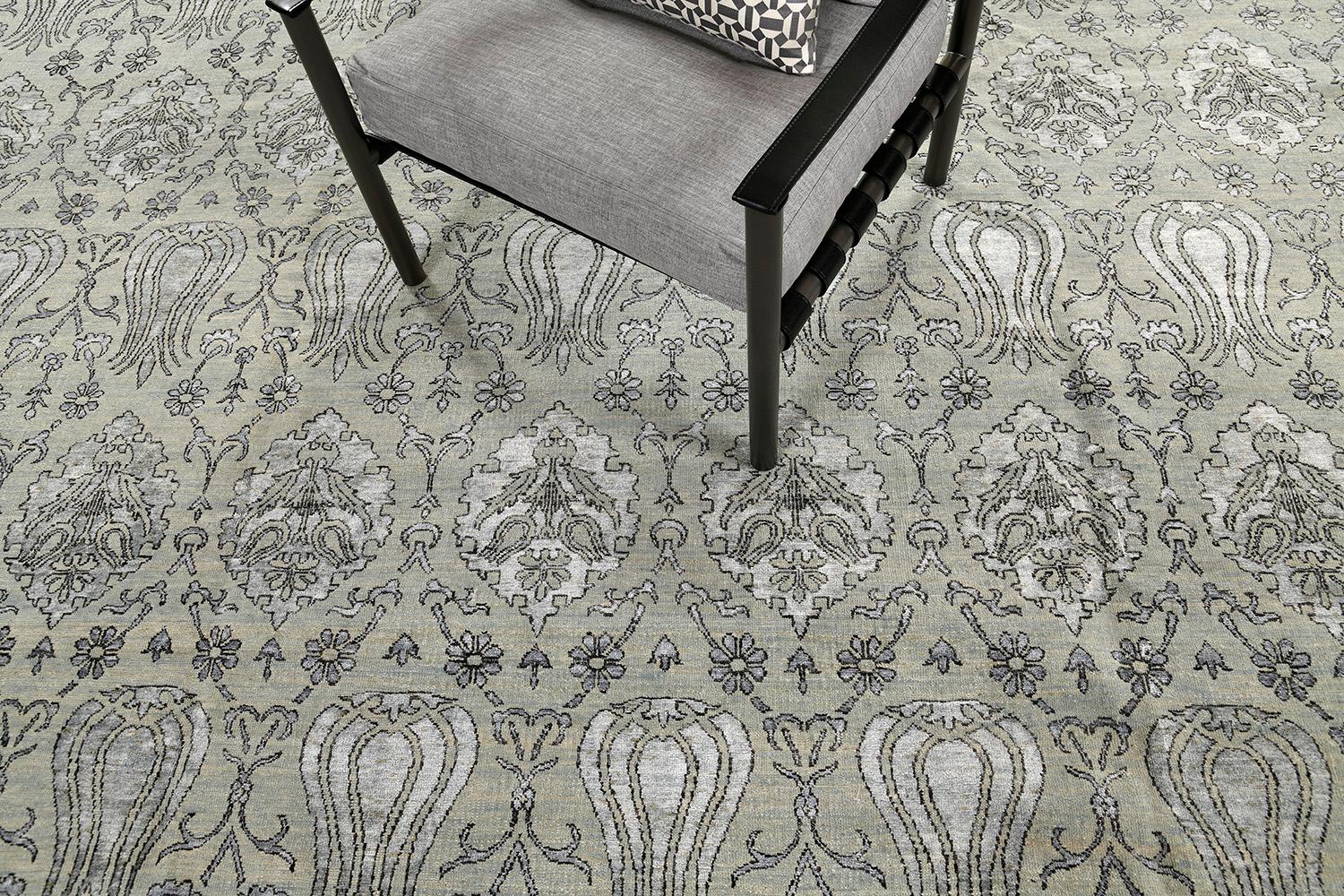 This unique transitional design from the Allure collection is the quintessence of charm and refinement. A wool pile weave that intricately weaves over a Pale blue variegated ground with blue silk motifs and indigo outlines set. A contemporary