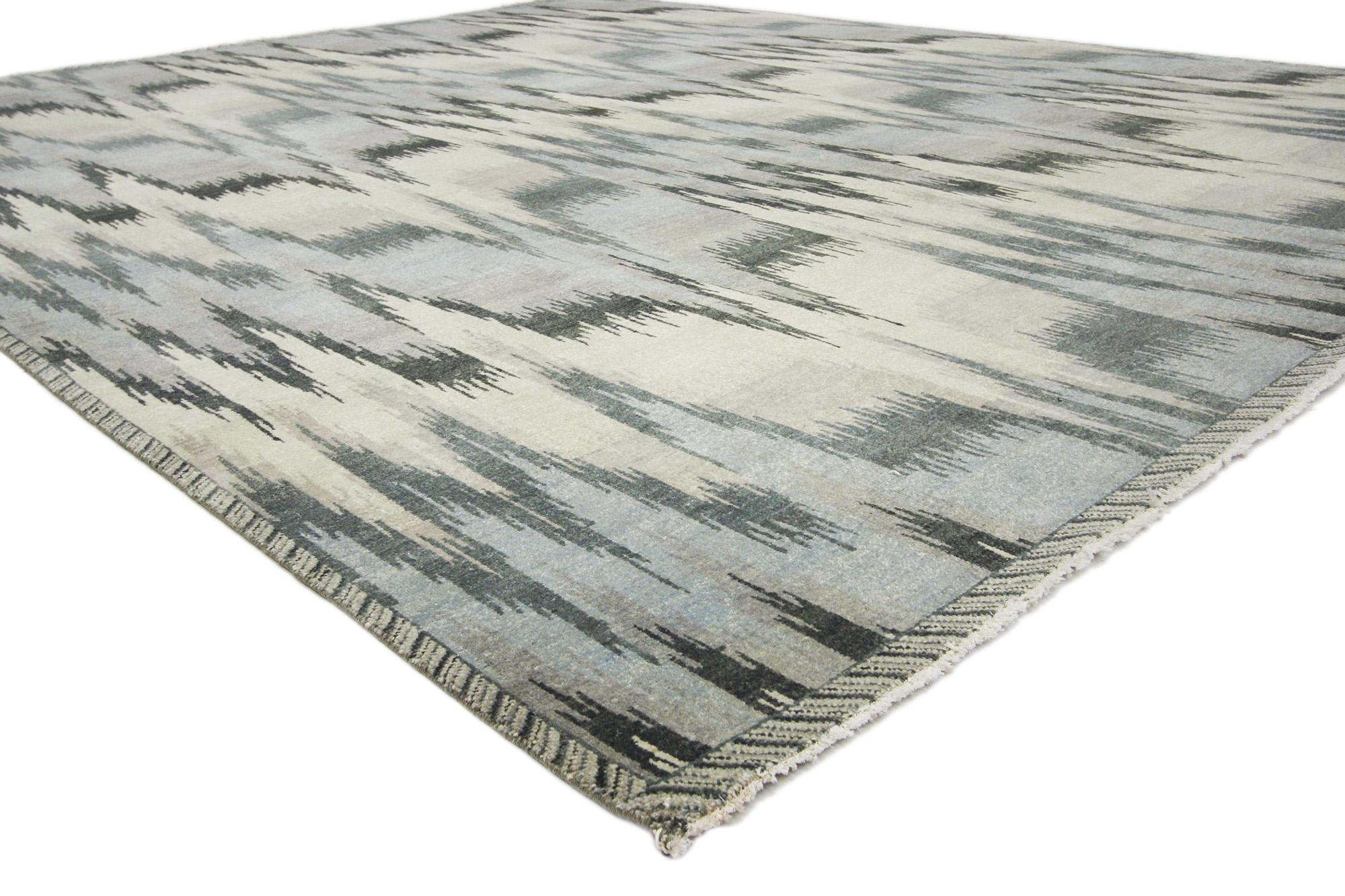 30048 New Transitional Ikat Rug, 08'00 X 09'09.
With its incredible detail and texture, this hand knotted wool Ikat rug from India is a captivating vision of woven beauty. The eye-catching  abstract ikat design and colorway woven into this piece