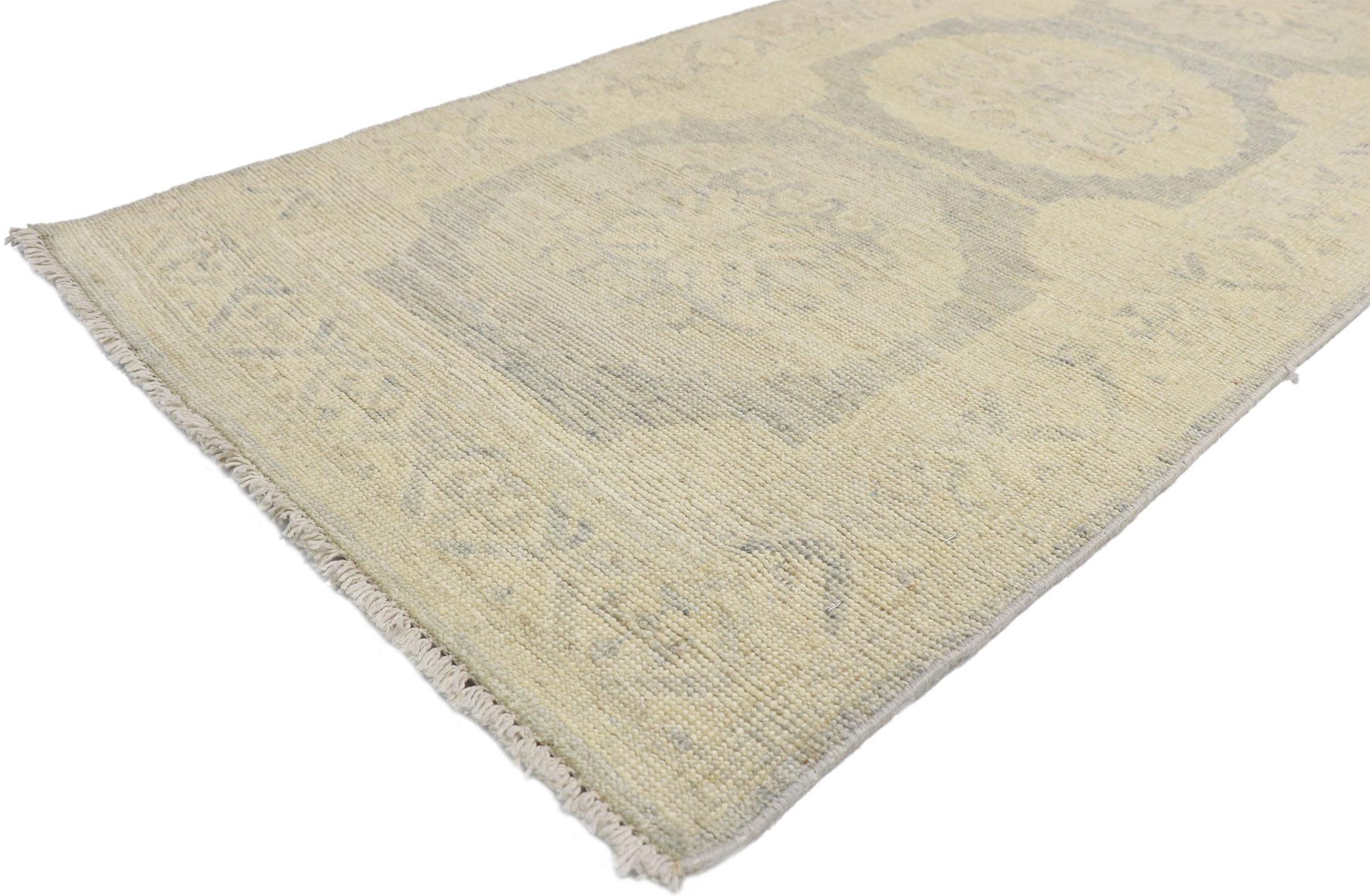 80183 Transitional Khotan style runner, extra-long hallway runner. Blending elements from the modern world with light and airy colors, this hand knotted wool transitional Khotan style runner charms with ease. The abrashed field features a botanical