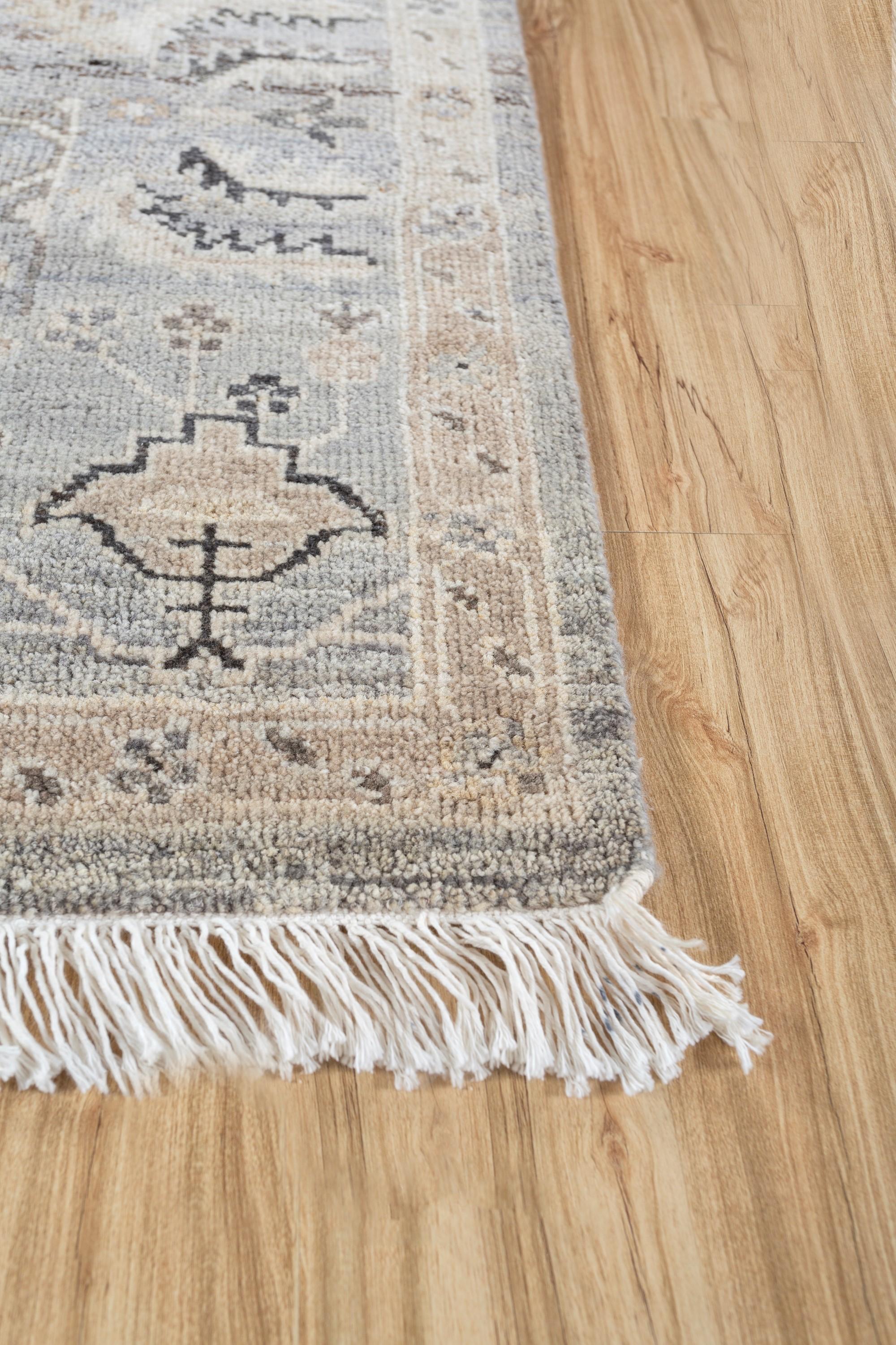 Embark on a journey of refined elegance with this transitional hand-knotted rug. Its understated arabesque foliage gracefully interlaces with dainty floral motifs, guiding you through a captivating narrative of curlicues, sacred geometry, and linear