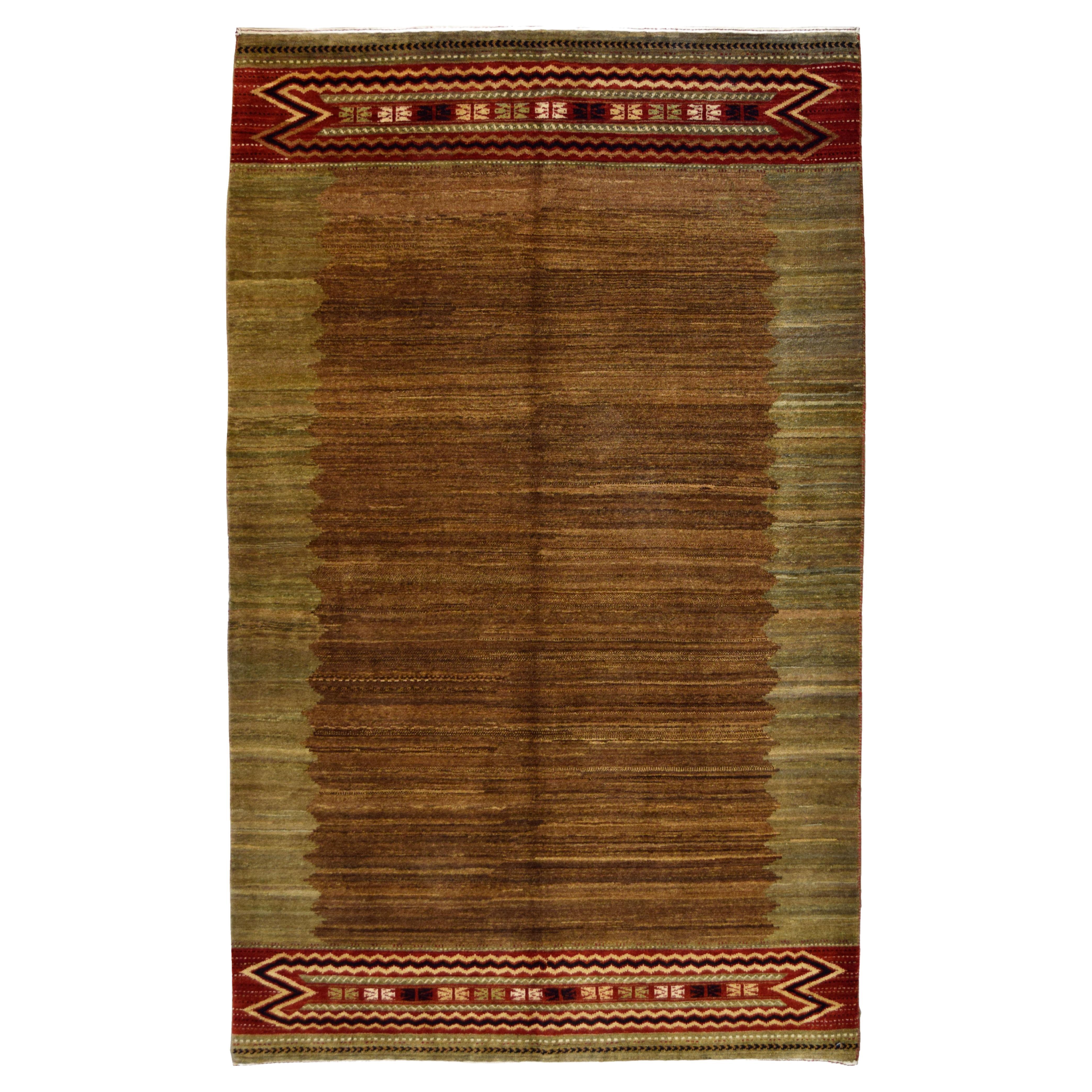 Alfombra tribal persa Qashqai verde, marrón y lana, 4' x 6