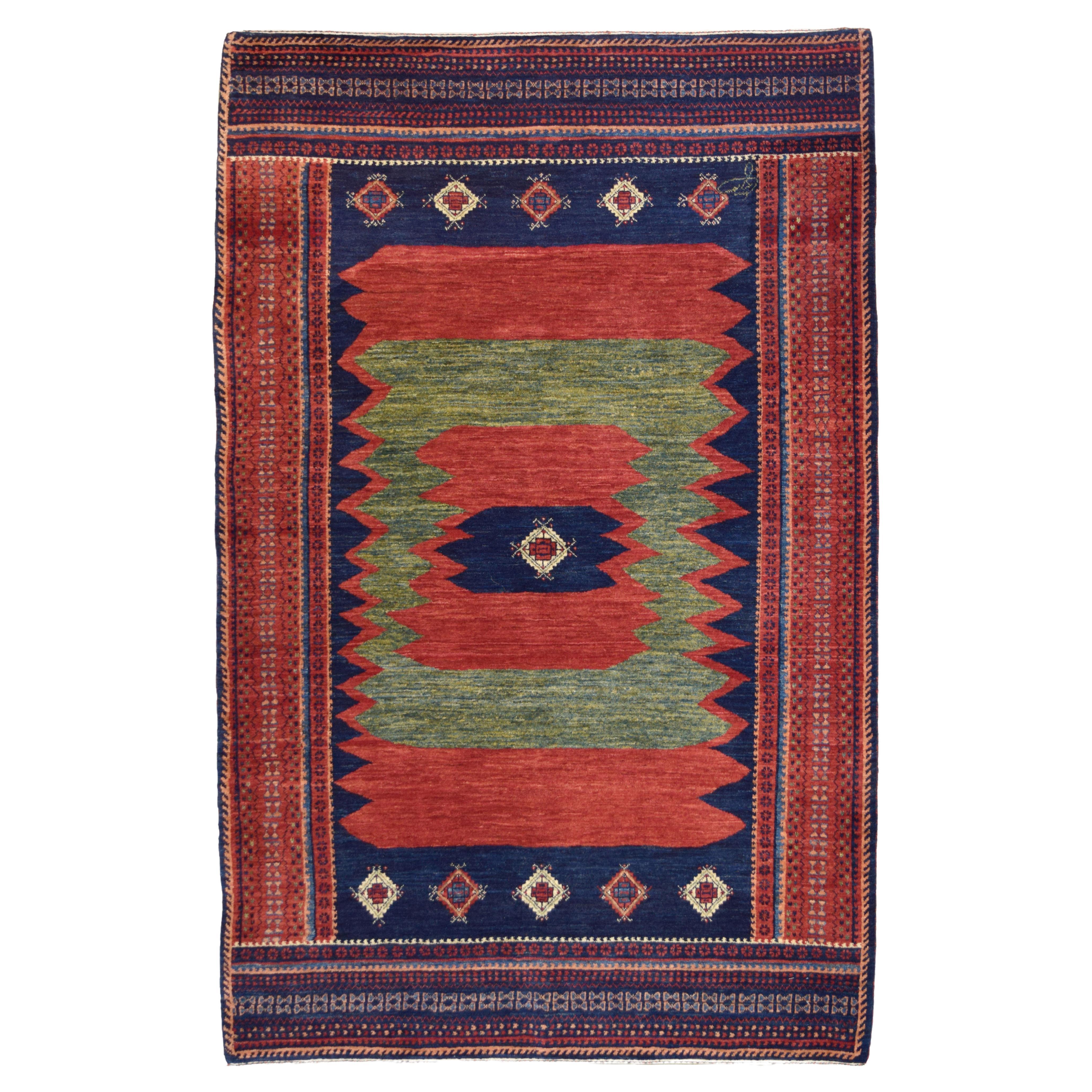 Tapis tribal persan Qashqai en laine nouée à la main, rouge, vert, indigo, crème, 4' x 6'