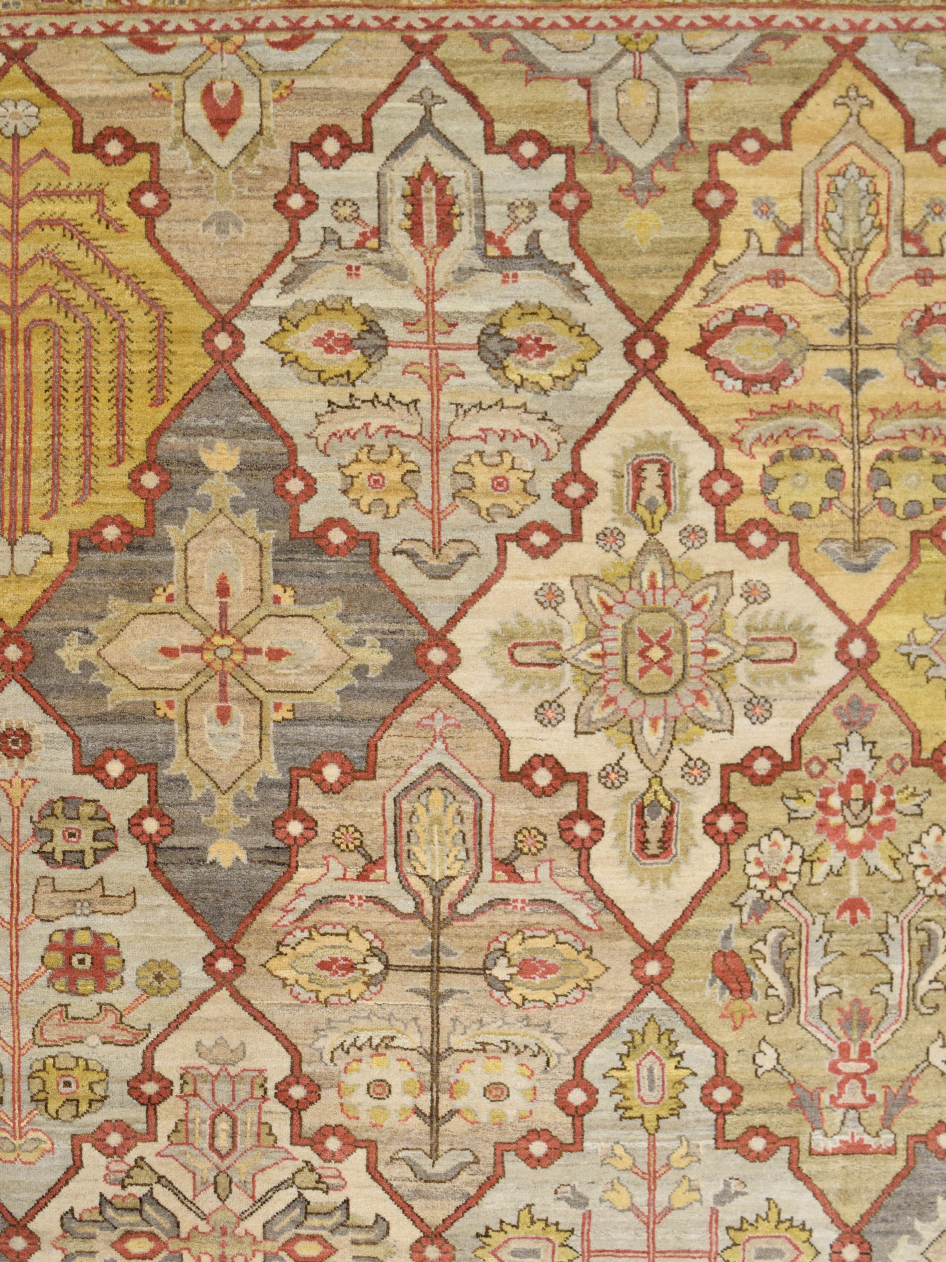 In warm and inviting shades of red, taupe, gray, and gold wool, this hand-knotted carpet features a classic Persian Bakhtiari design and belongs to the Orley Shabahang Transitional Collection. Measuring 10’ x 13’10”, this carpet features a cotton