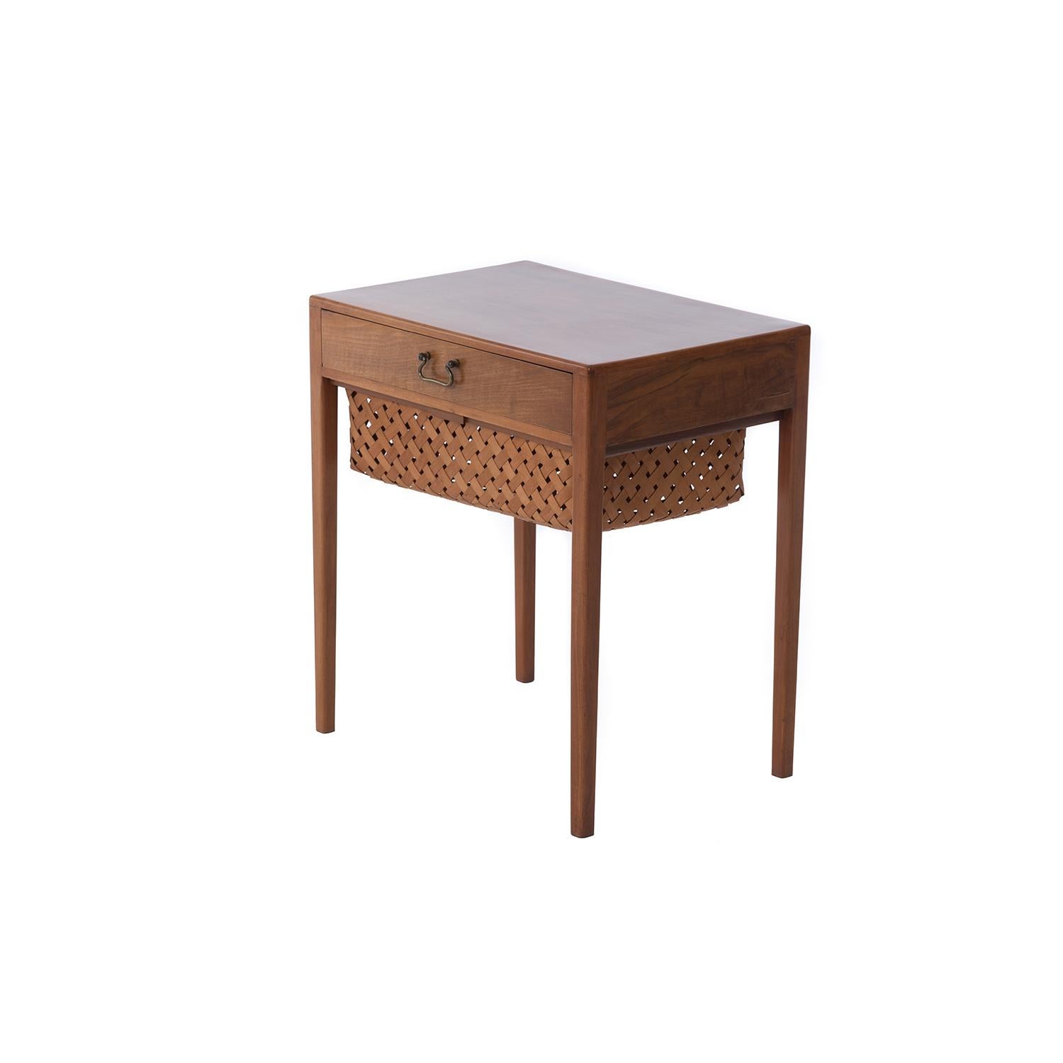 This sweet table is crafted from Cuban mahogany. Intended as a sewing table but versatile for use as an accent piece almost anywhere. We call this 'transitional' because it skirts two eras of furniture crafting in Denmark, displaying elements of