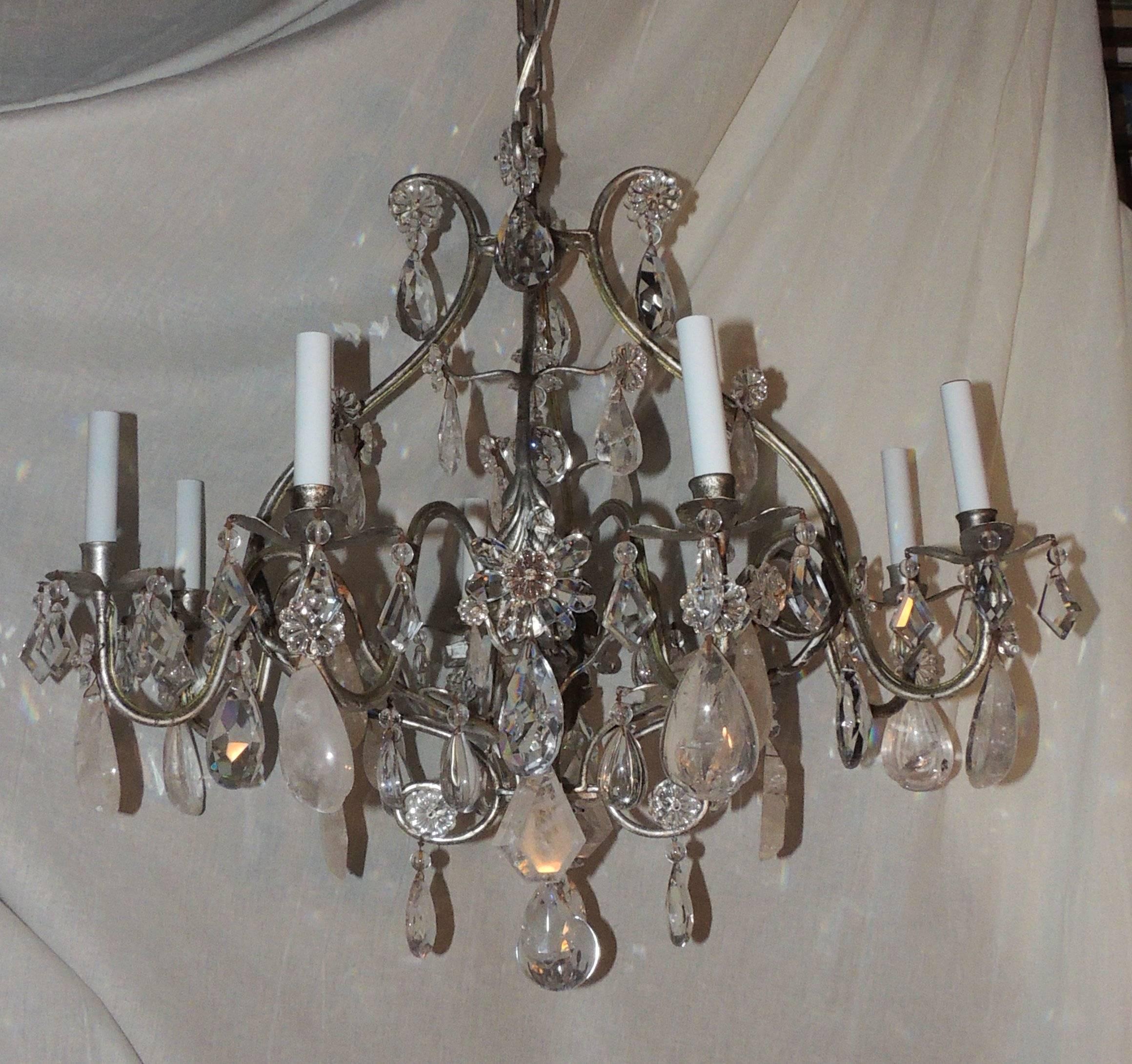 Transitional silvered gilt Baguès eight-light rock crystal Jansen chandelier fixture


Measures: 30