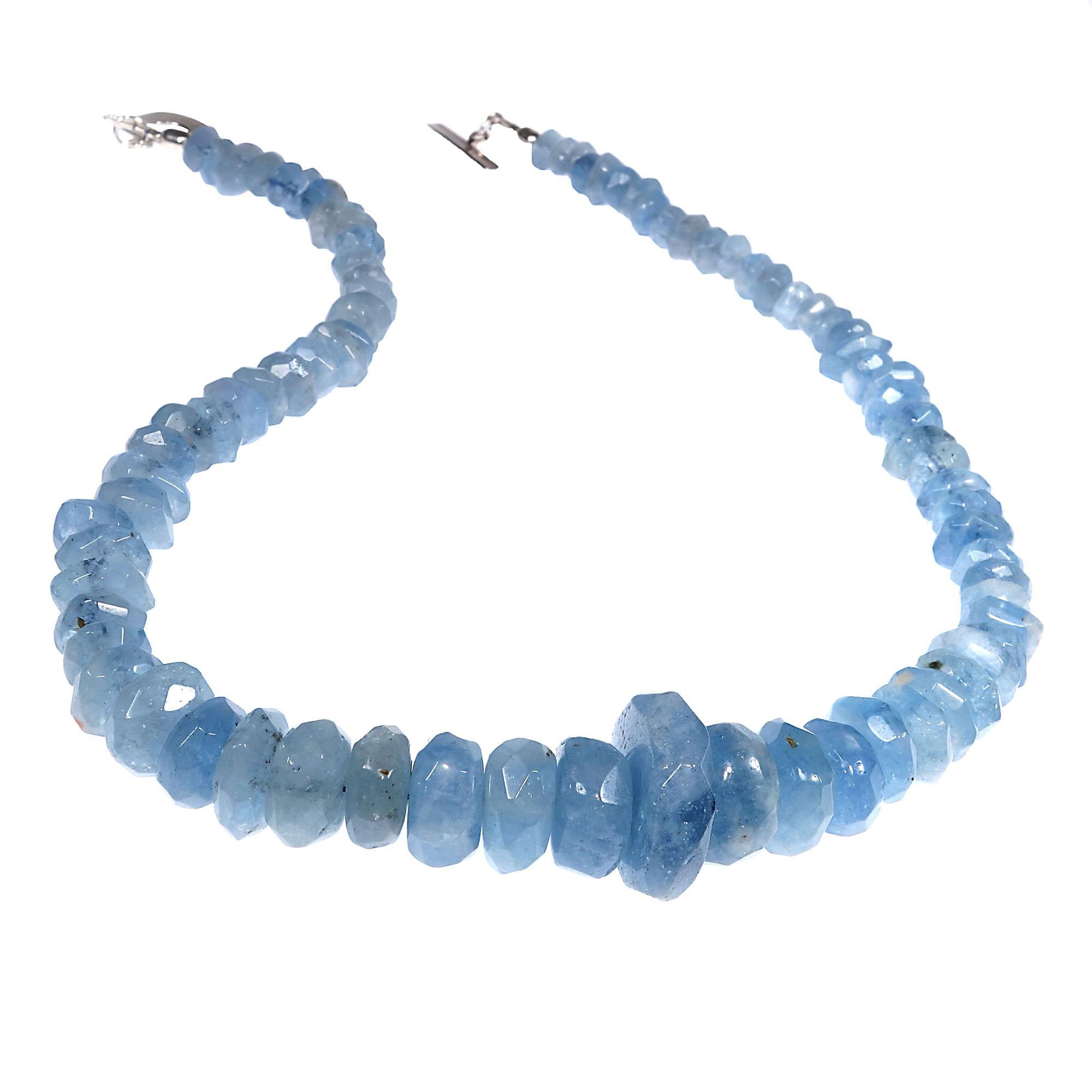 Unique 17 Inch necklace of translucent blue Aquamarine rough cut rondelles.  These gorgeous graduated Aquamarines will make your head spin. This handmade necklace is secured with a Sterling Silver toggle.  