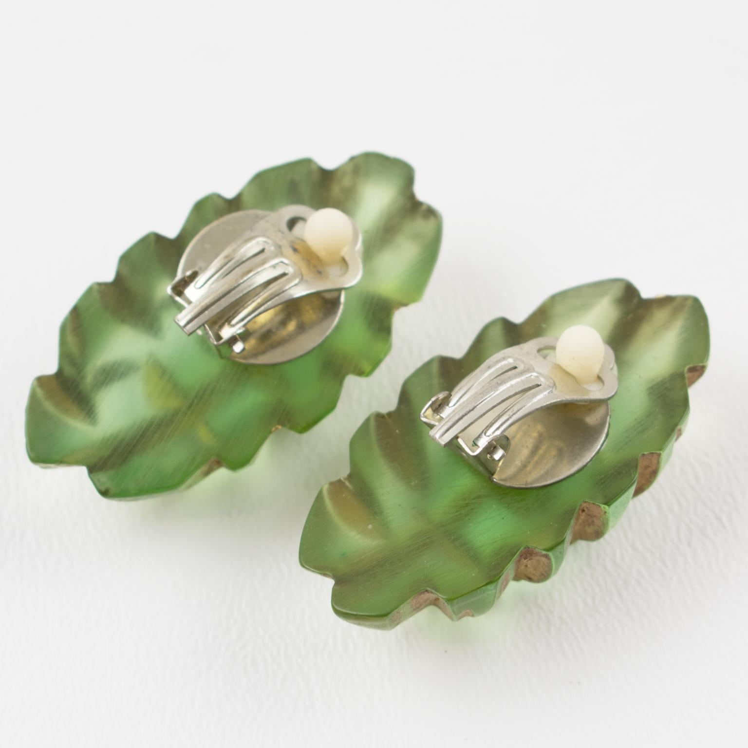 Translucent Green Lucite Clip Earrings with Gilt Application Carving In Excellent Condition For Sale In Atlanta, GA