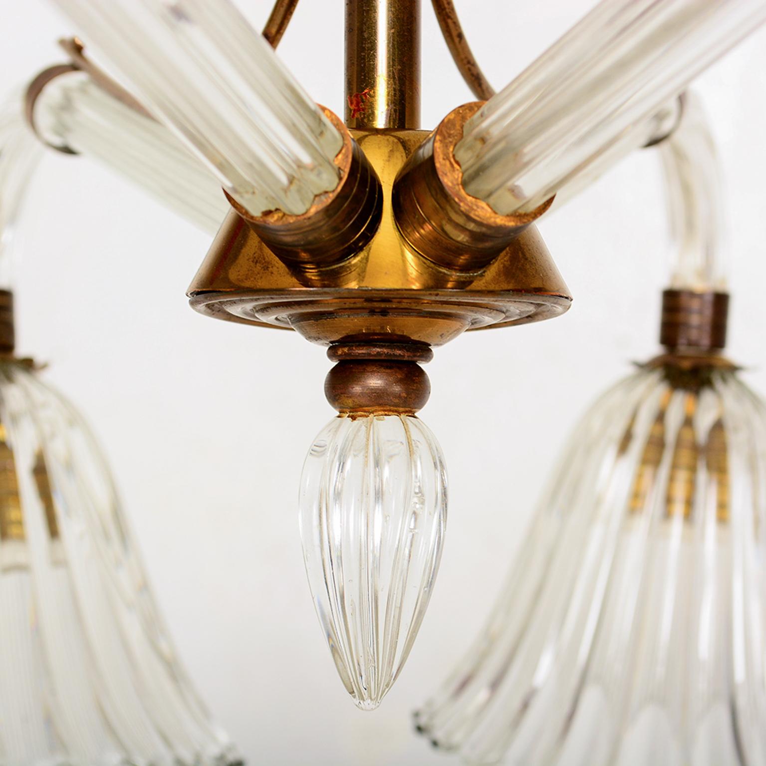 AMBIANIC presents
Translucent Venetian Murano Glass Hanging Chandelier with Brass accents.
Unmarked. Style of Ercole Barovier Art Deco design of Barovier Seguso & Ferro. ITALY 1940s
Chandelier has been rewired. It requires four regular bulbs.
One