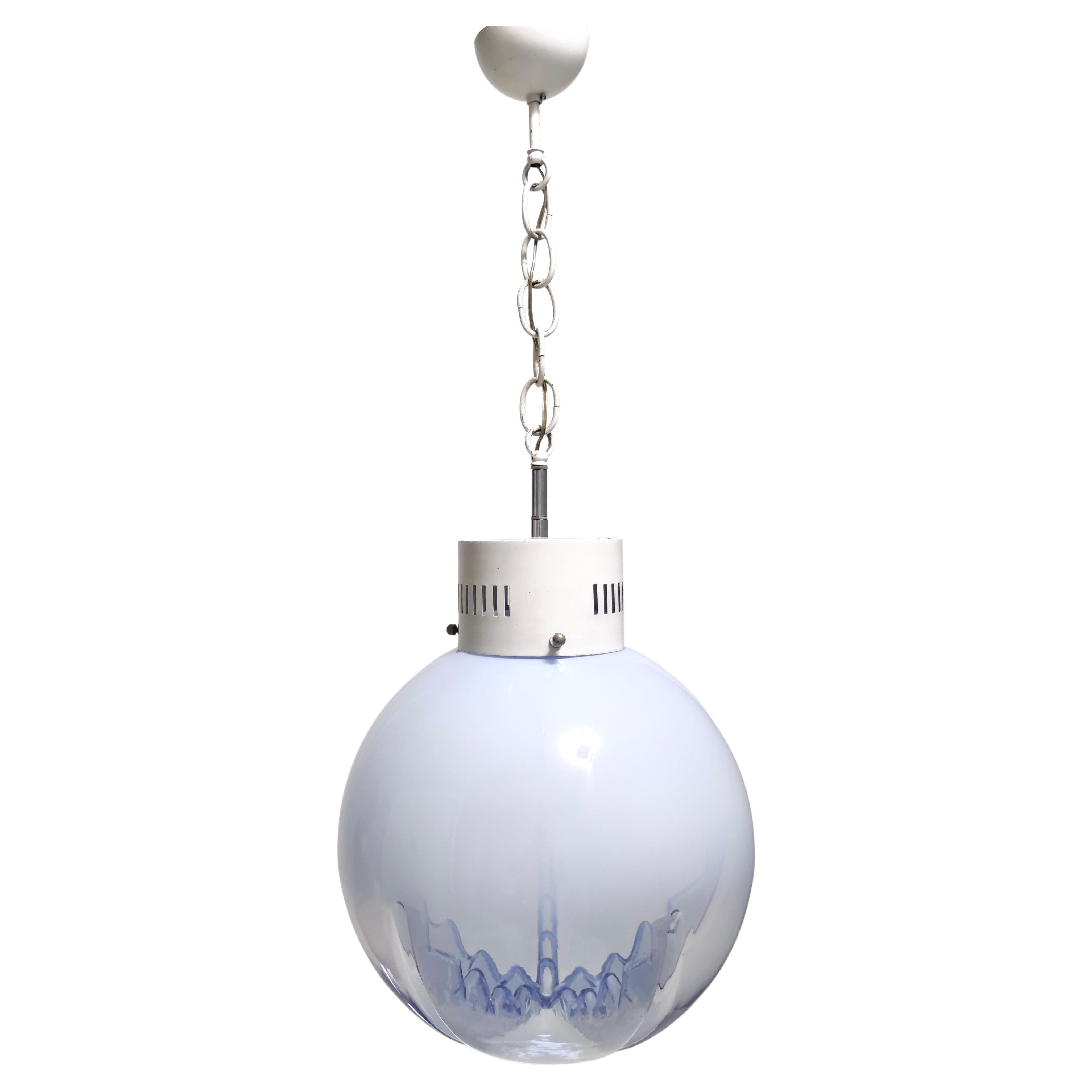 This is a high quality item, made in Italy, in the 70s. 
The pendant features a white varnished metal frame and a spherical transparent and blue Murano glass shade.

Nason is a well-known glass artist known for his use of historical techniques in