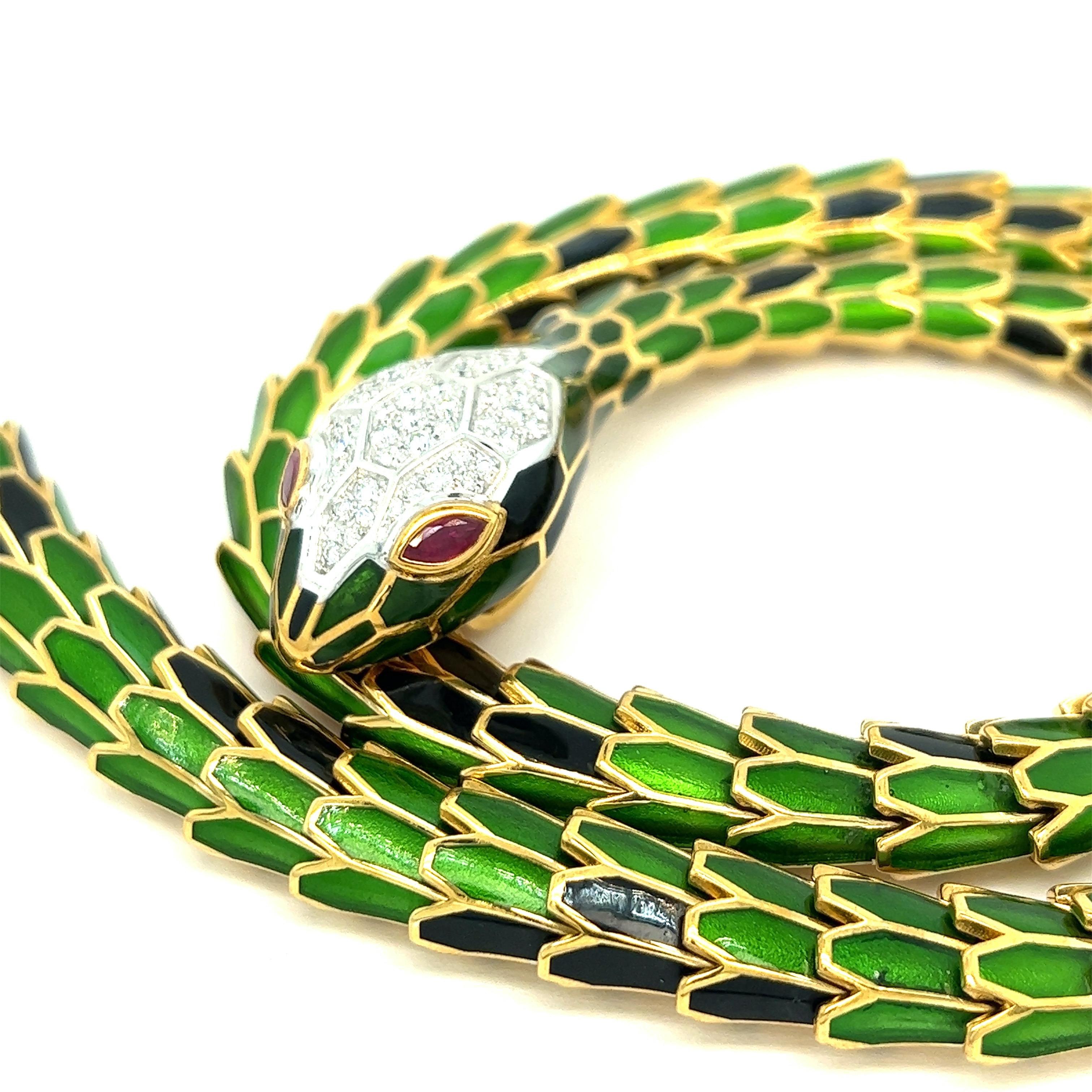 Transparent green and black enamel snake necklace, short model

Round-cut diamonds of 1.20 carats, Marquise-shaped rubies of 0.56 carat, 18 karat white gold, silver with a tone of yellow gold; marked 750, 925, D. 1.20, R. 0.56,