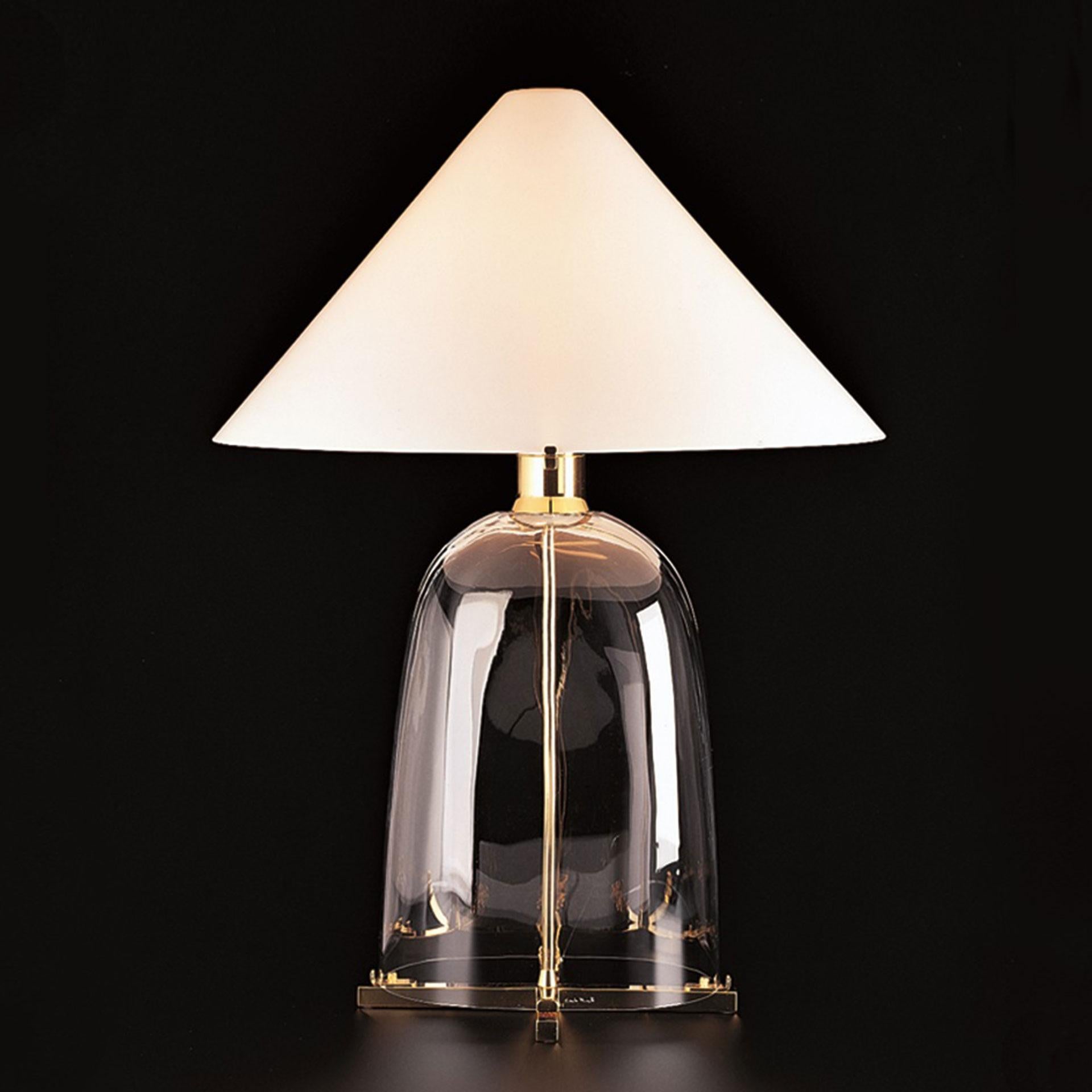 Chosen as one of Architectural Digest “best new lights, 2015”, Ovale is a table lamp of mouth blown Murano glass with mouth blown Murano white opaline glass shade mounted on gilded metal. The lamp was designed in 1983 by Carlo Moretti.