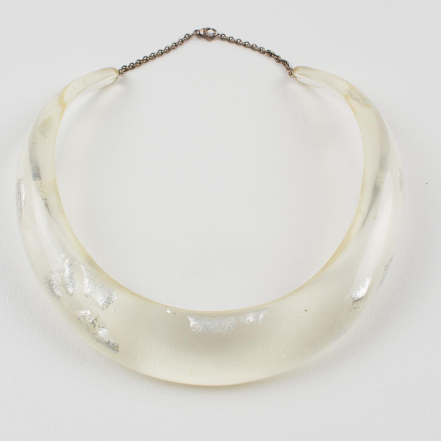 This elegant Italian artisan-designer studio collar choker necklace boasts a Lucite or resin rigid bib shape in translucent clear color complimented with silver flakes inclusions in an organic abstract free-form design. A silvered metal chain helps