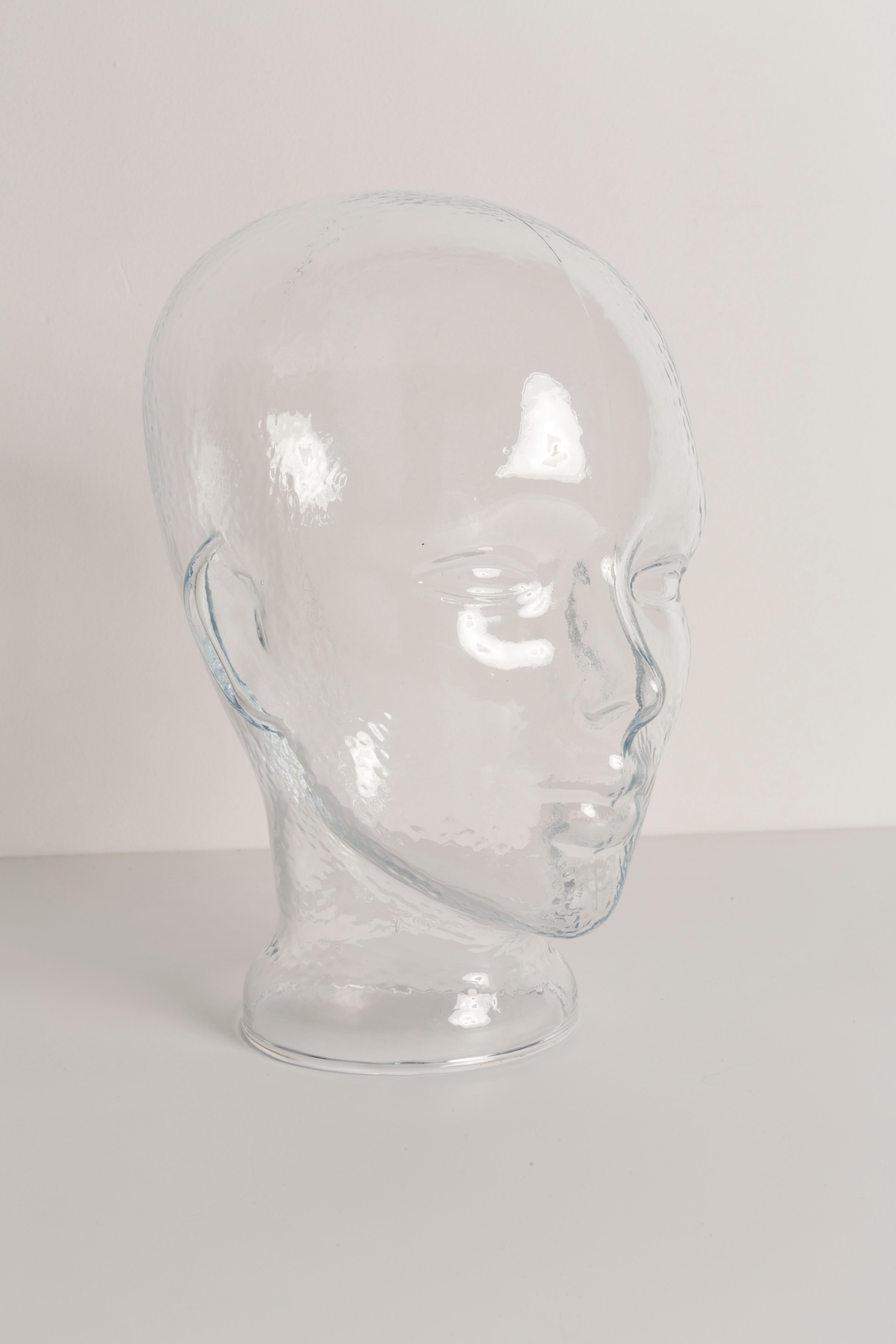Life-size glass head in a unique transparent color. Produced in a German steelworks in the 1970s. Perfect condition. A perfect addition to the interior, photo prop, display or headphone stand.