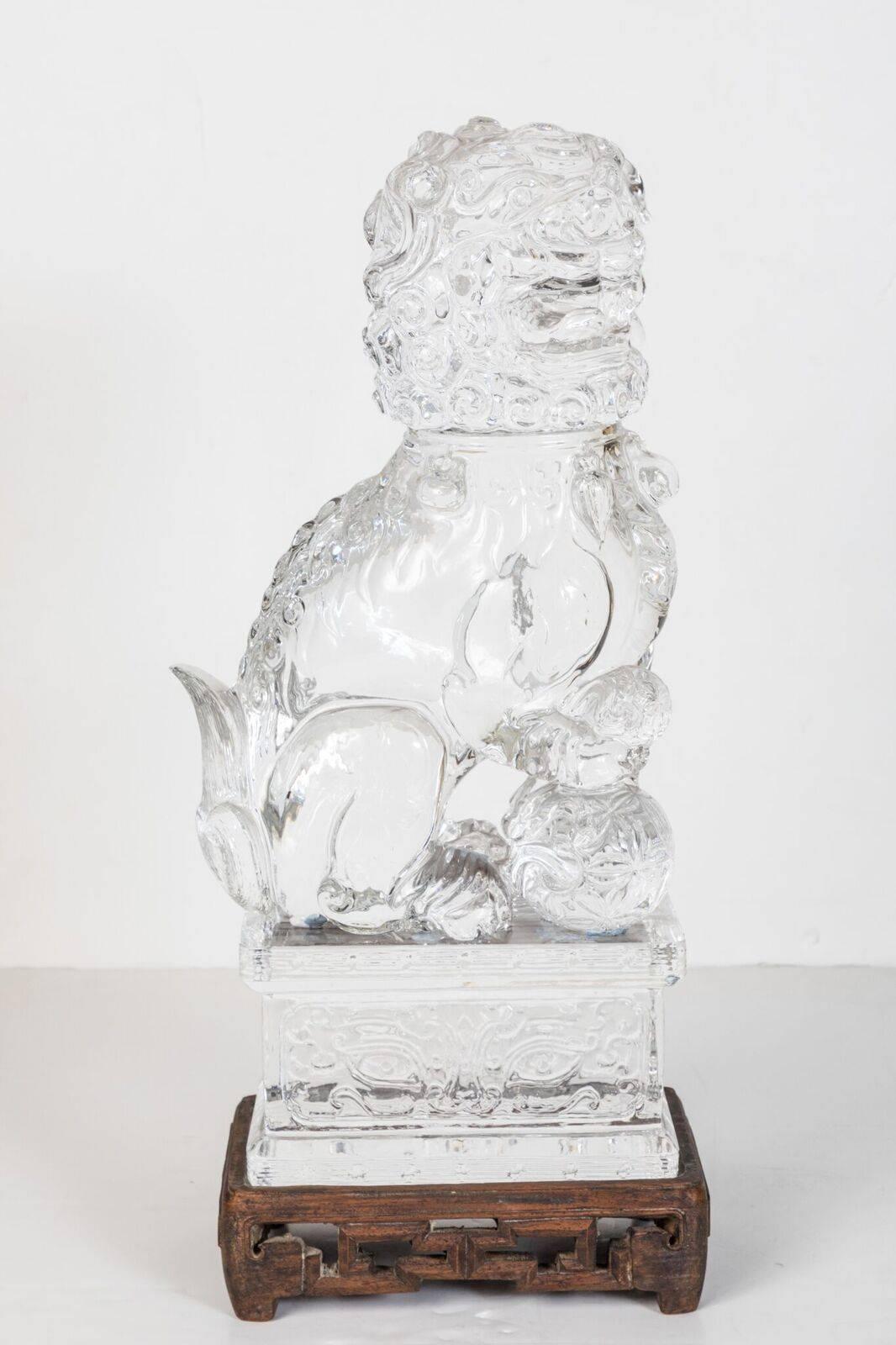 Dazzling pair of left and right, Peking Glass Foo dogs on matching, solid glass, incised bases. Pierced wood bases are optional.