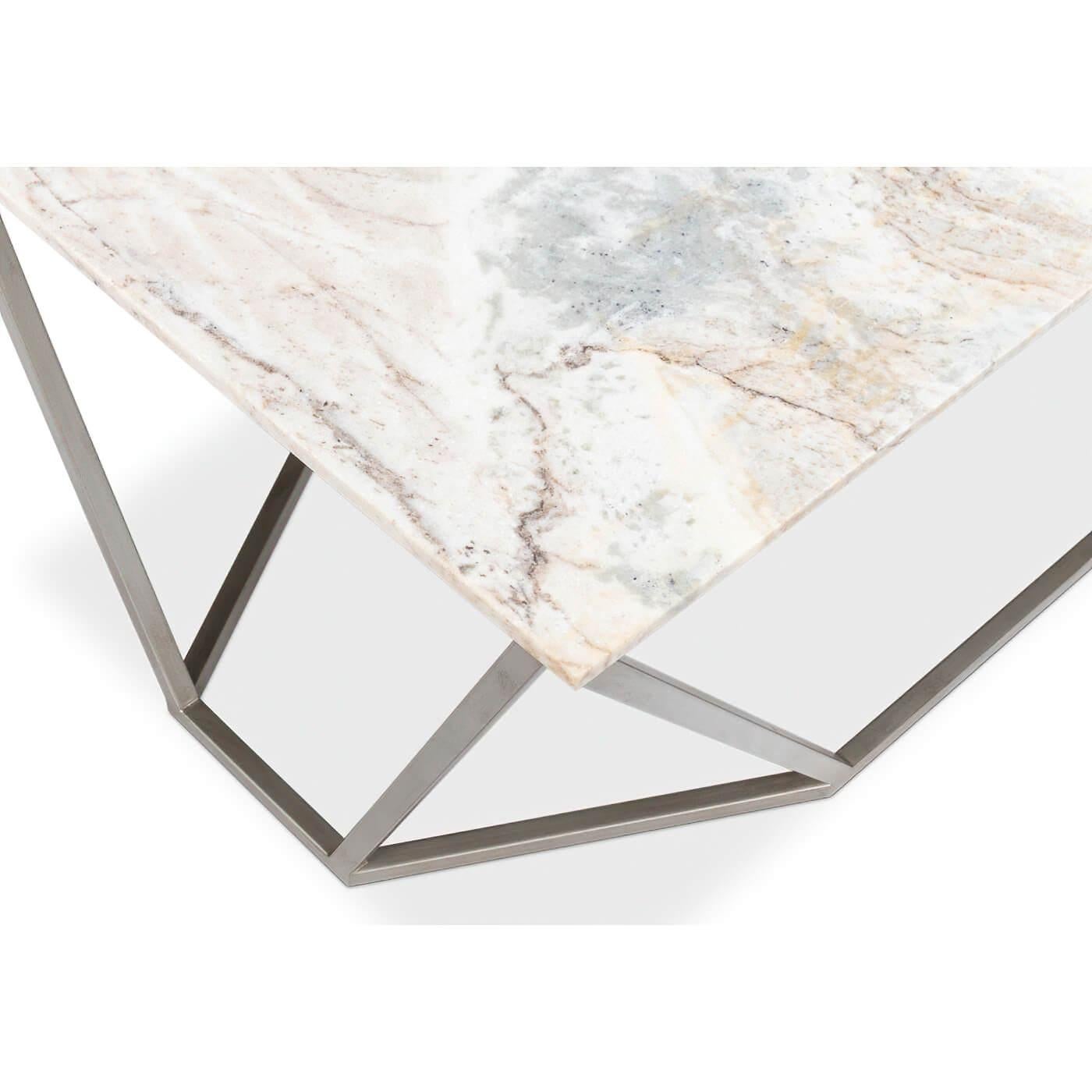 A modern trapezoid base coffee table with a marble top. This coffee table has a striking geometric design with a brushed silver metal base and a beautiful marble top with unique veining and color variations. 

Dimensions: 44
