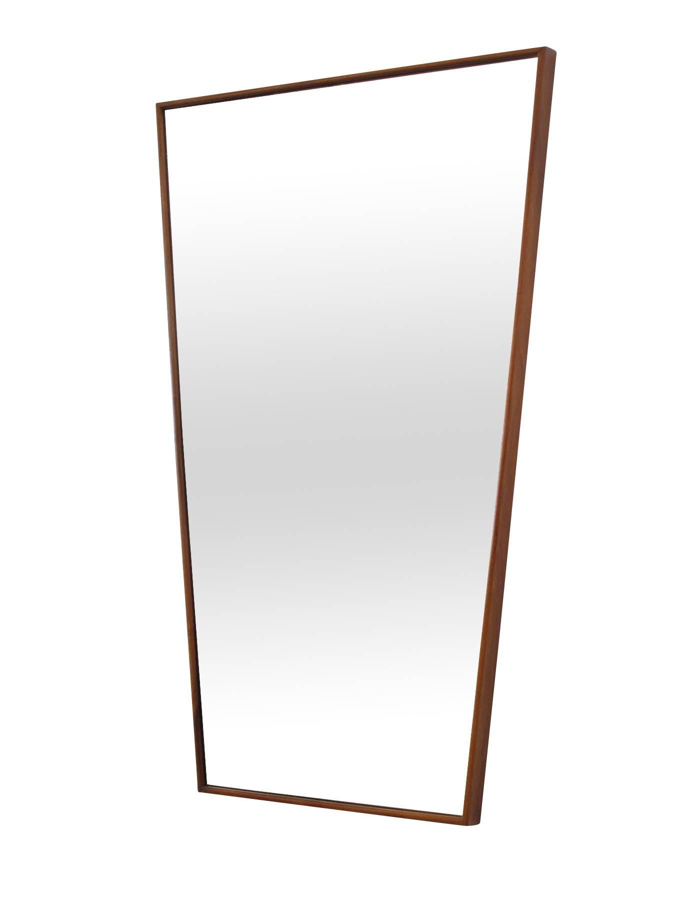 Midcentury walnut trapezoid mirror.

Top width is 25