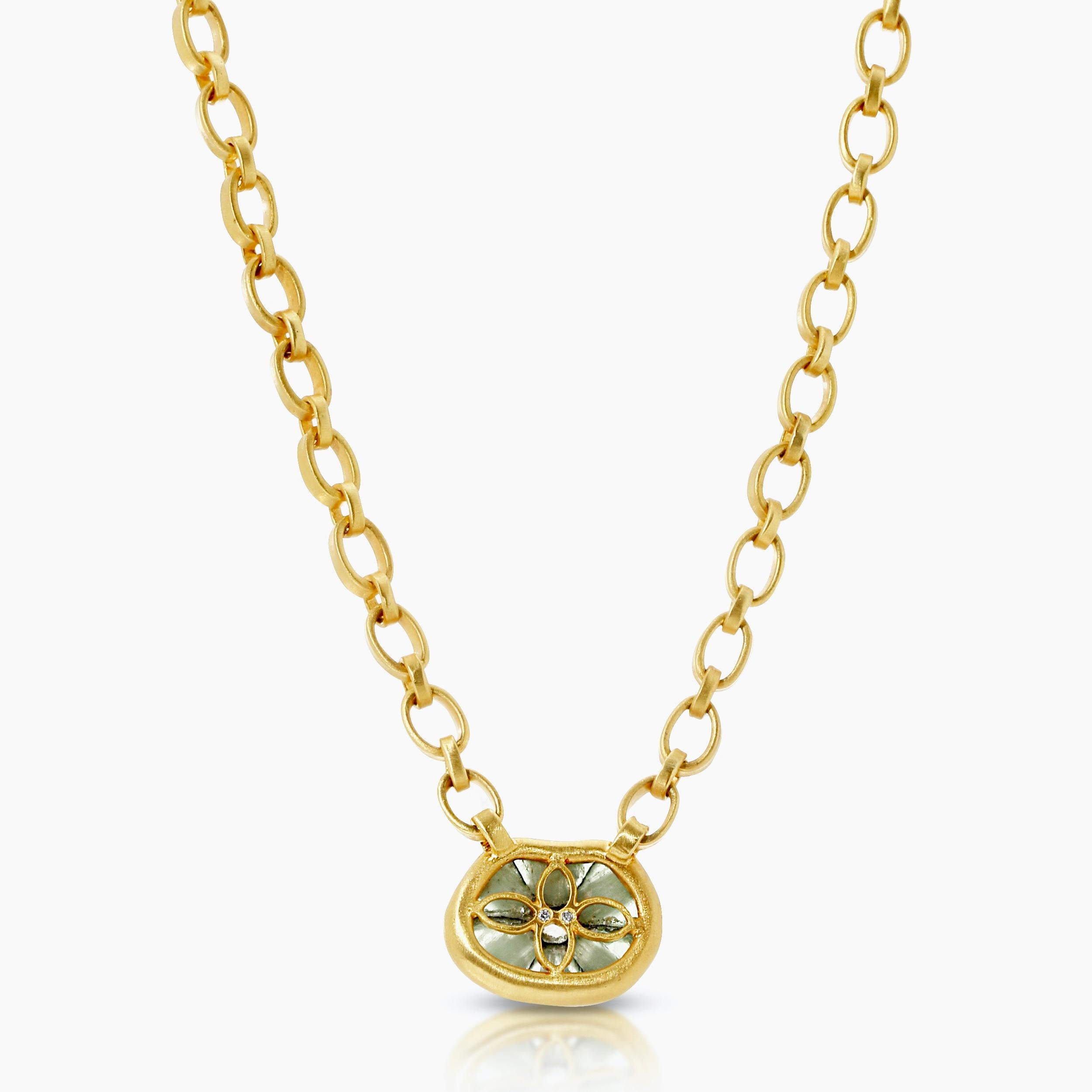 A 4.20ct Freeform Brazilian trapiche Emerald is Bezel Set in 18k Yellow Gold on a  17in. Handmade Chain and Toggle Closure. The Bezel is connected to the Handmade Chain with .08ct vs quality Diamond Pave set in the loops and the Toggle is accented