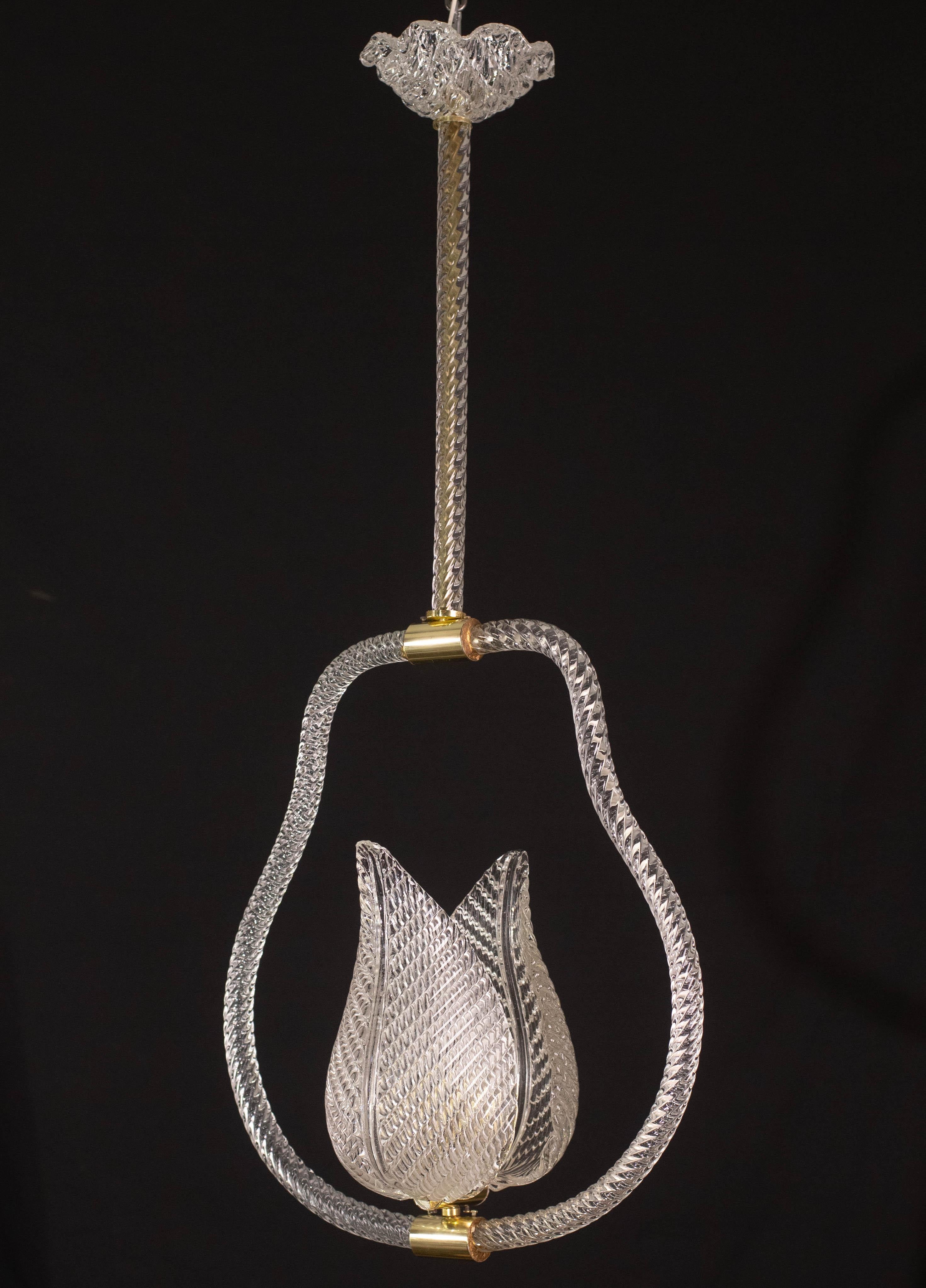 Stunning Murano chandelier by artist Ercole Barovier.
The pendant consists of 6 glass elements and a brass structure.
It mounts a European standard e27 lamp.
It measures 85 centimetres in height and 40 centimetres in width, 45 cm height with no
