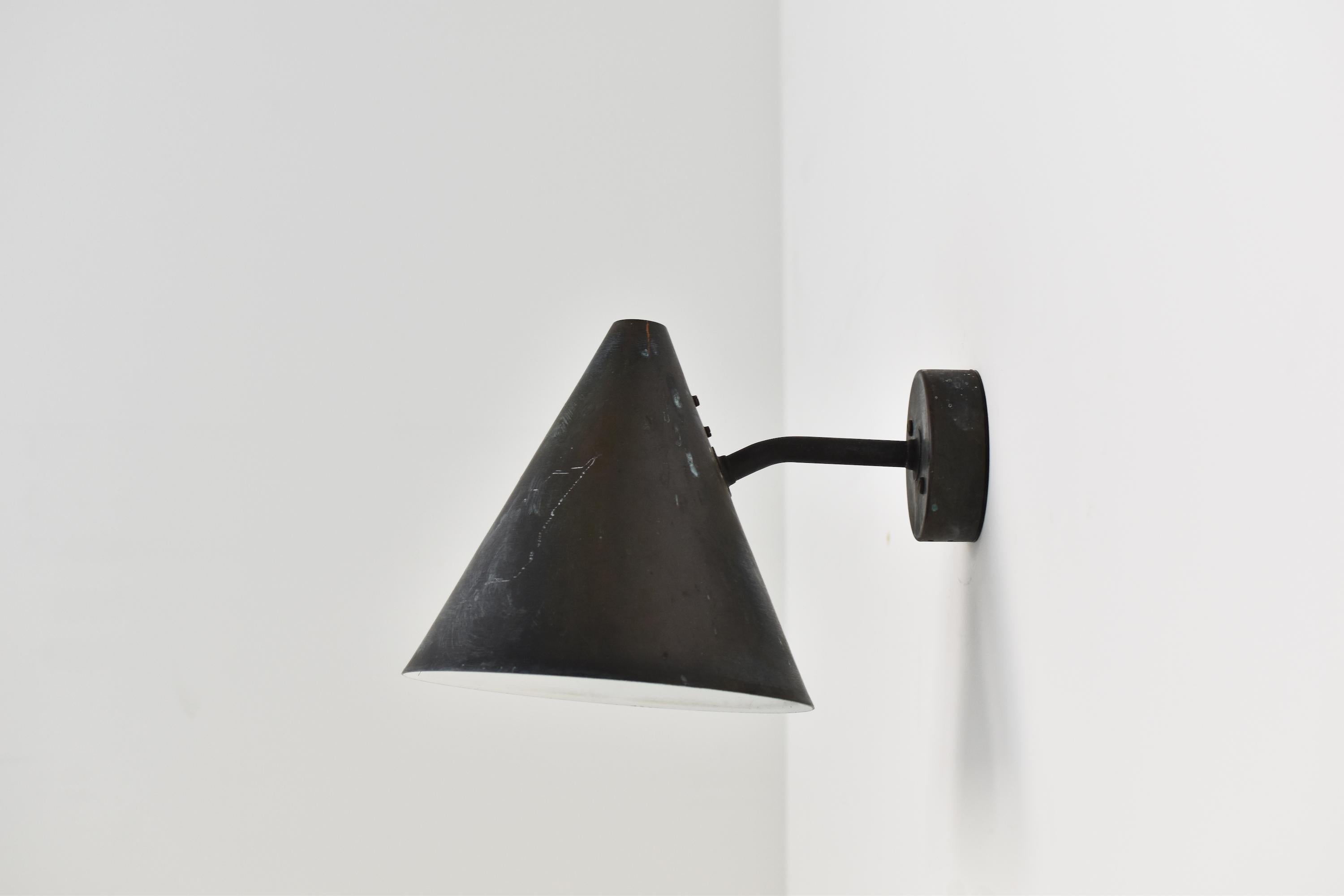 Cone shaped wall lamp by Hans Agne Jakobsson for AB Markaryd, Sweden 1950s. This is model ‘Tratten’ in beautifully patinated copper with an off-white inside. Labeled.