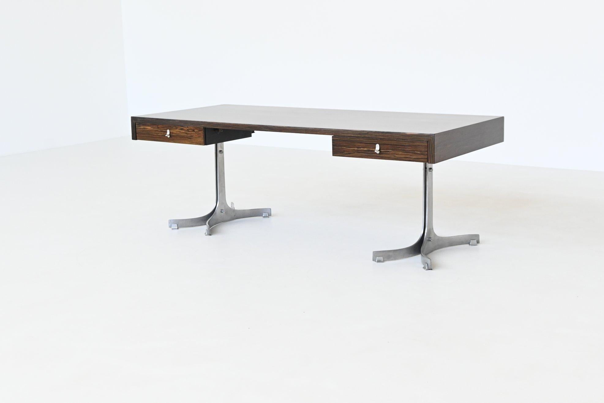 Striking large executive desk designed and manufactured by Trau Arredamenti Metallici S.P.A., Italy 1960. This sophisticated desk features a rectangular top in highly figured rosewood veneer, paired with sleek brushed aluminum pedestal bases. The