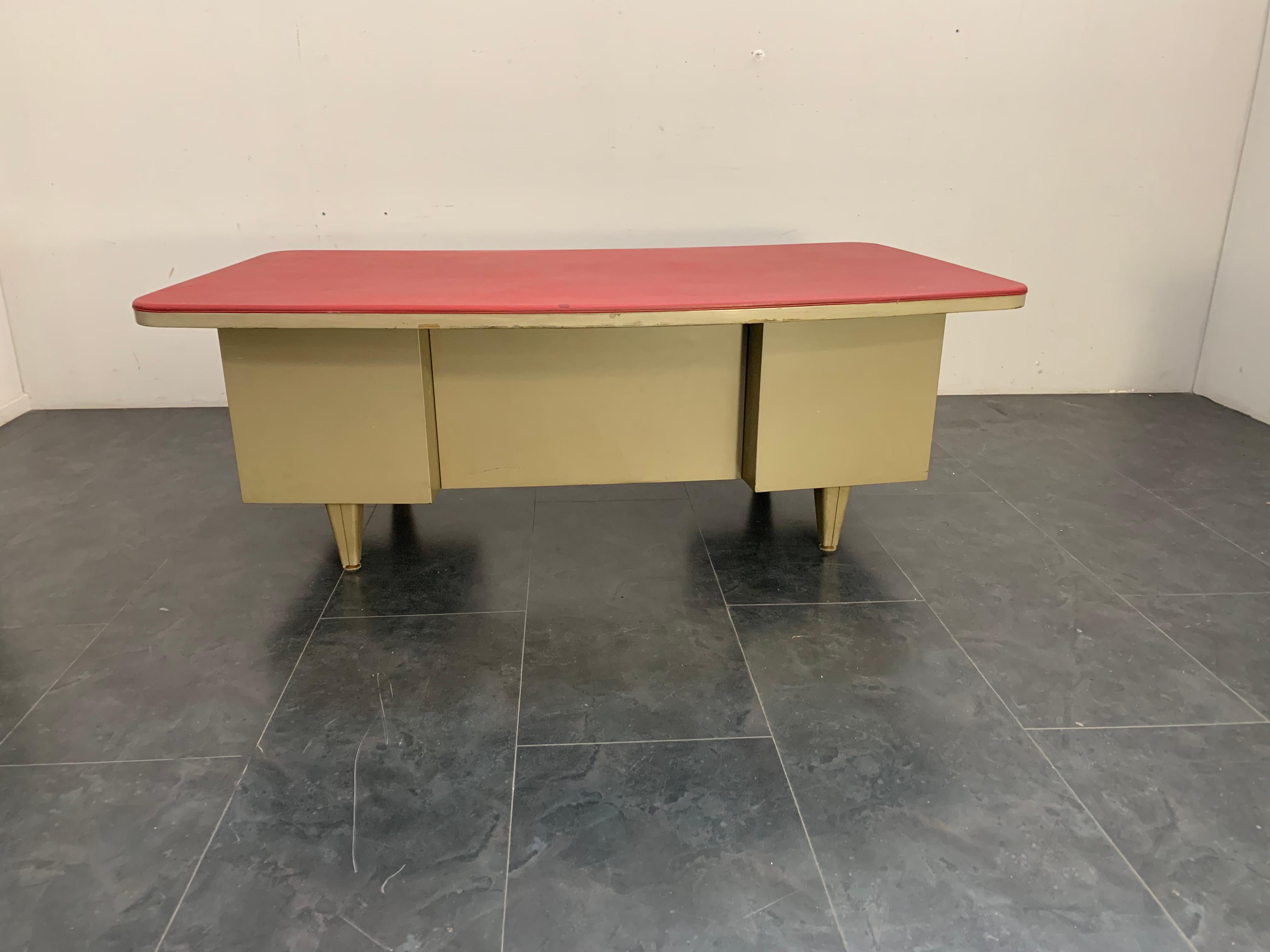 Vintage metal desk made by Trau in Turin in the 1950s. 5 drawer gray metal structure with red faux leather curved thick top.