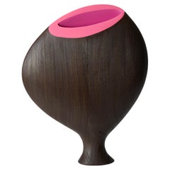 Travaglini 0.1, a tulip wood sculpture with bright pink interior by Donald Baugh