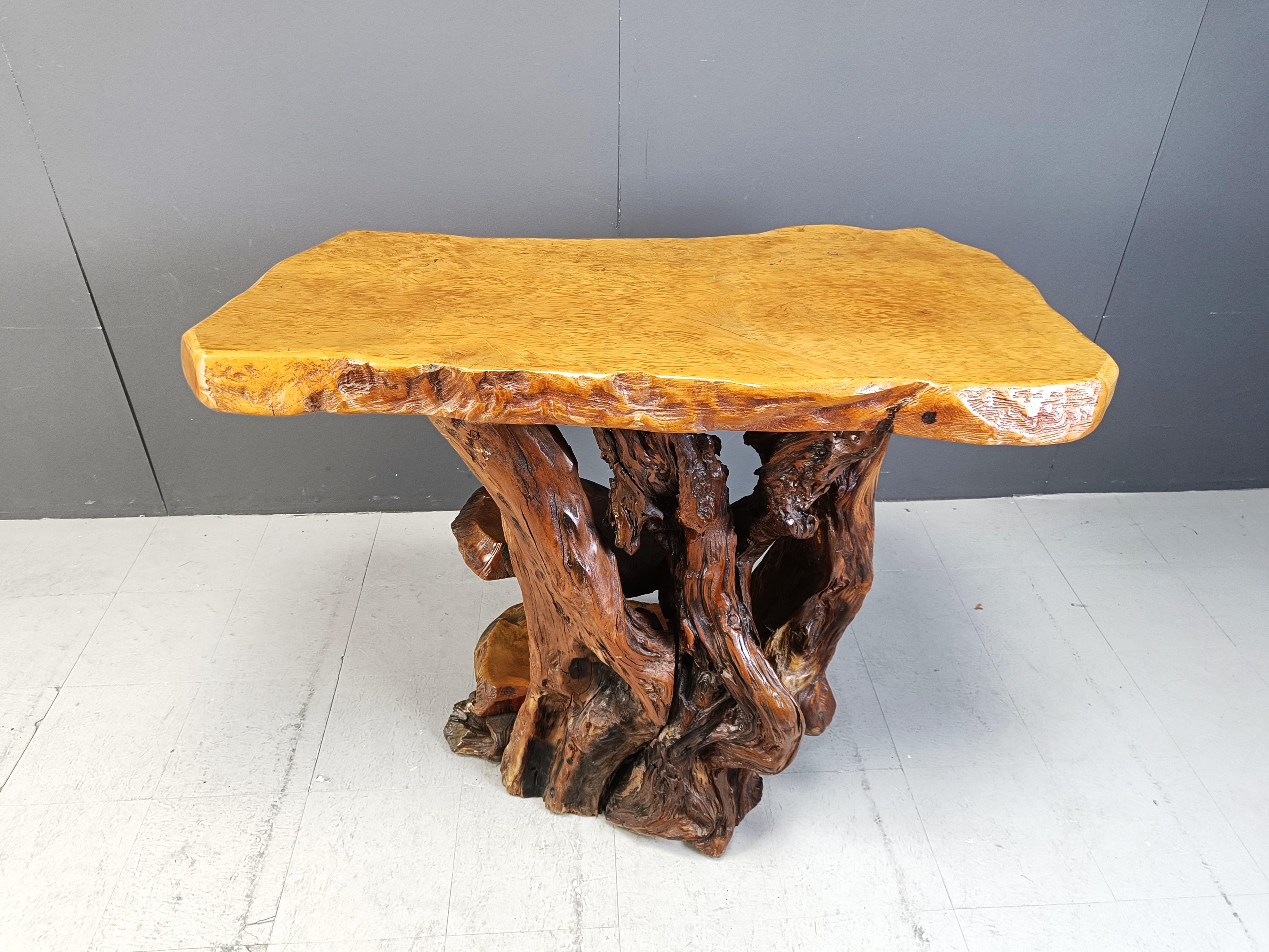 Heavy and solid olive wood tree root console table.

Beautiful base and top, a true piece of art shaped by nature.

This can be widely combined with lots of interiors.

1960s - Italy

Dimensions:
Height: 107cm
Width: 125cm
Depth: 65cm

Ref.: 24120902