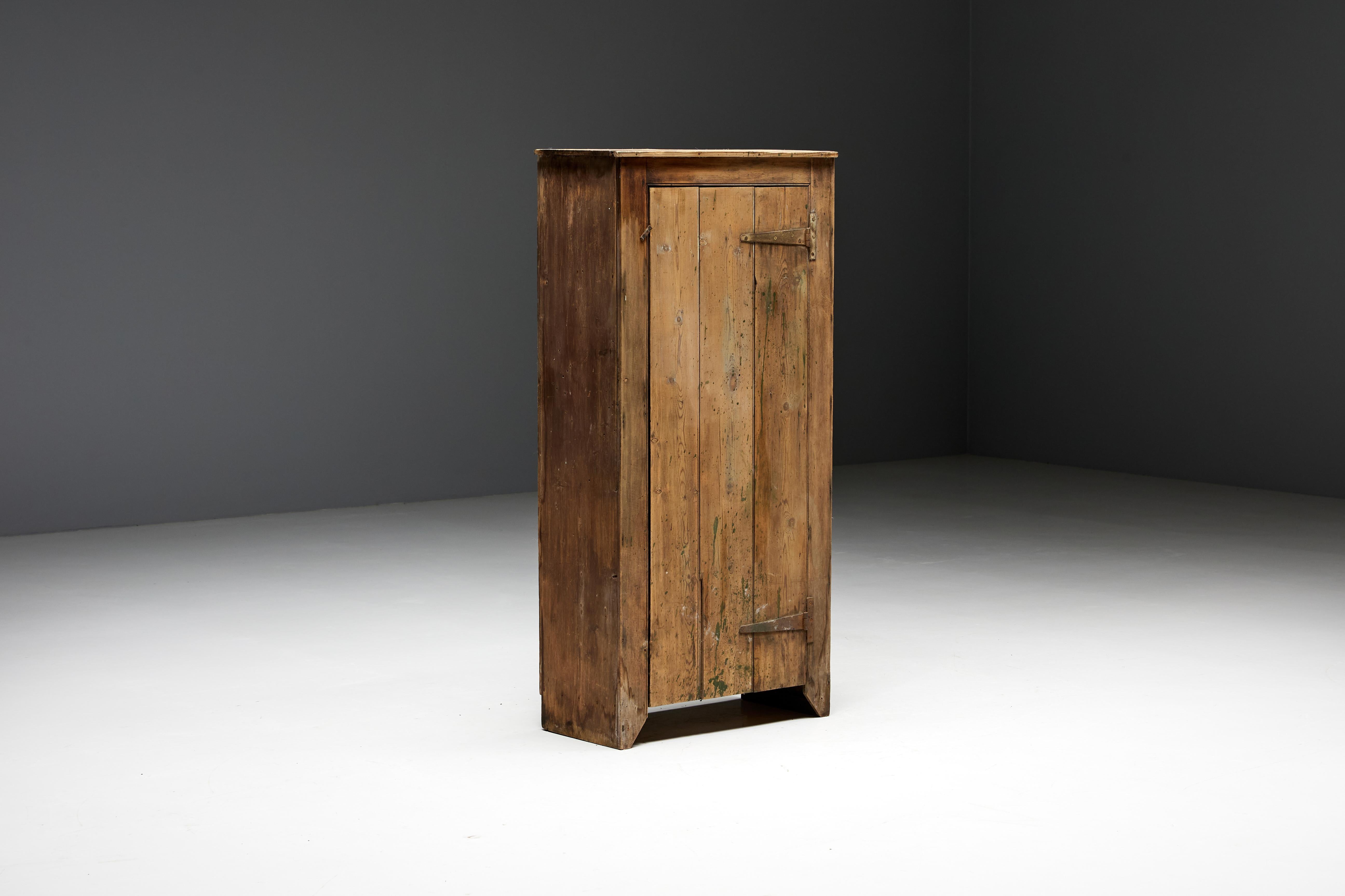 Art populaire cabinet, a stunning example of skilled craftsmanship, embodying the rich heritage and timeless beauty of the 19th-century period. Constructed from the finest wood, this cabinet showcases the unparalleled artistry of artisans who have