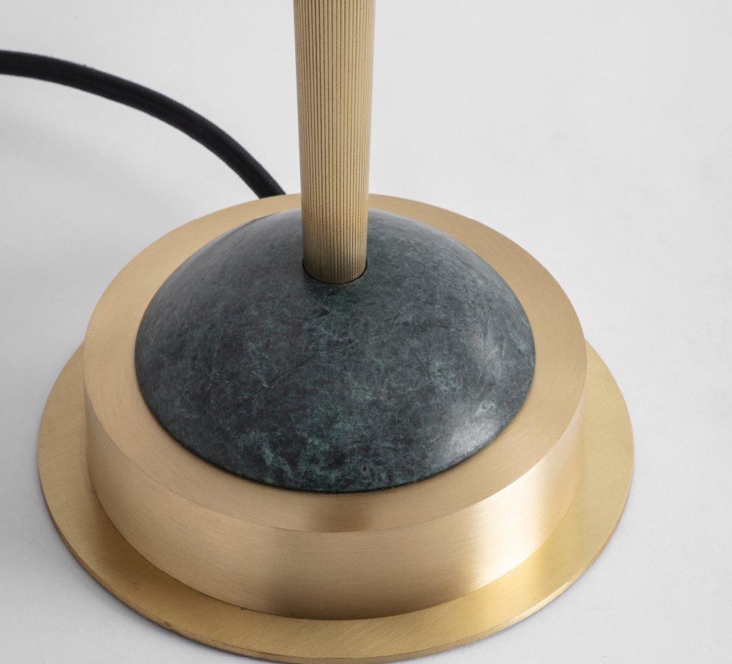 Trave table lamp green by Bert Frank
Dimensions: 40.5 x 30 cm
Materials: Brass, glass, marble

Available in green or white colors.

A two-tier, soft-finish opal glass shade sheds a halo of ambient light from a delicately fluted, knurled, gently