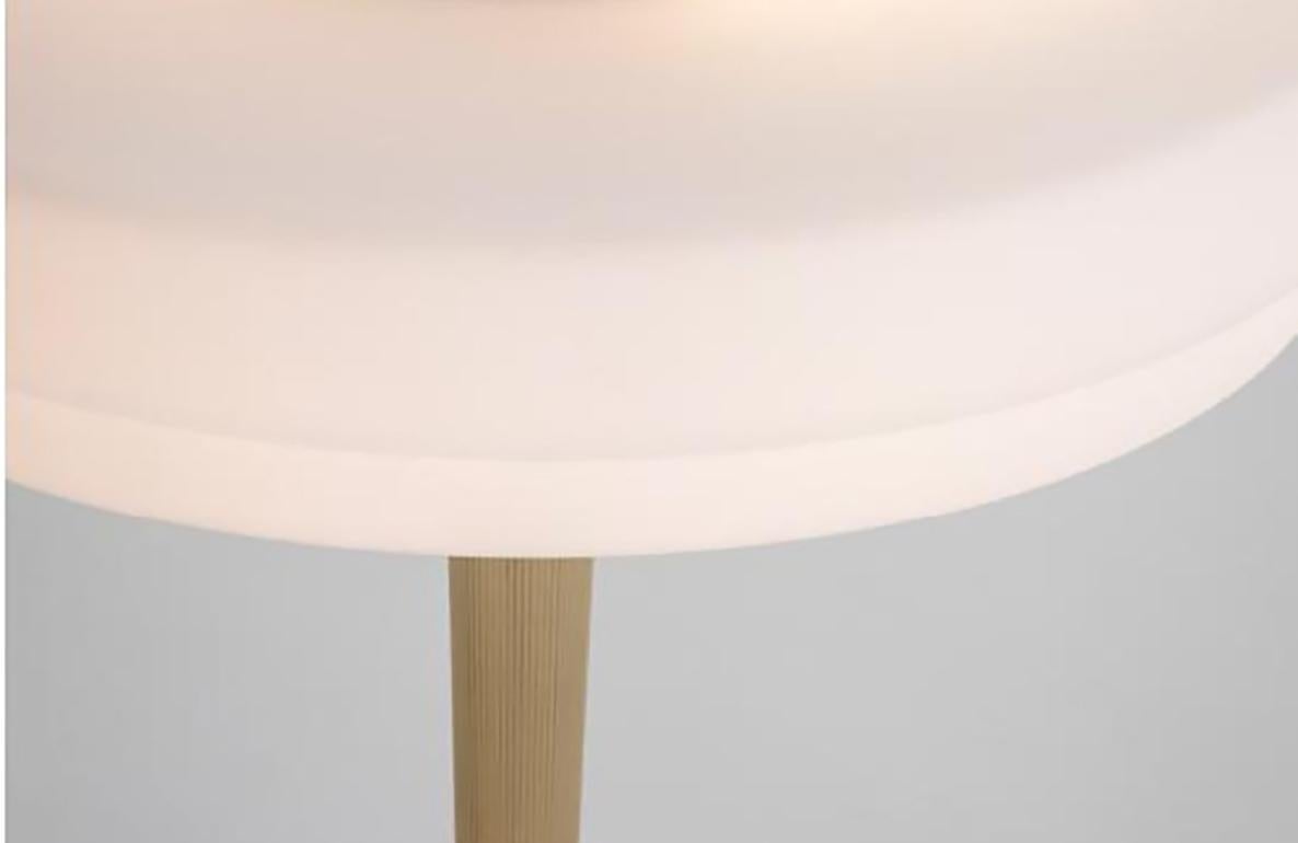 Trave table lamp white by Bert Frank.
Dimensions: 40.5 x 30 cm.
Materials: brass, glass, marble

Available in green or white colors.

A two-tier, soft-finish opal glass shade sheds a halo of ambient light from a delicately fluted, knurled,