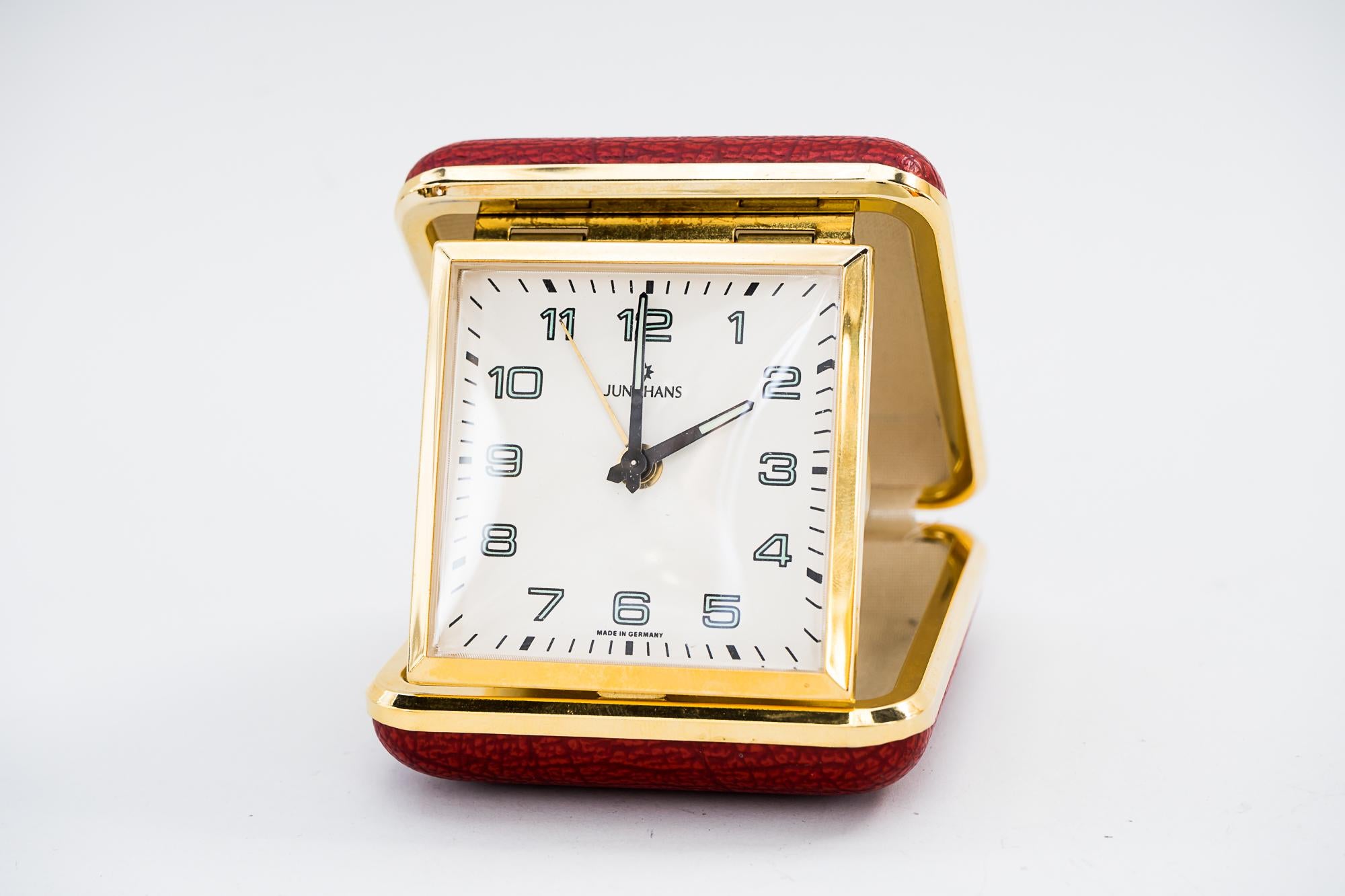 Travel alarm clock by Junghans, circa 1960s
Original condition
Brass with red faux leather cover
Still working
Measures: Open height 8cm, wide 7cm, deep 8cm
Closed height 3cm, wide 7cm, deep 8cm.