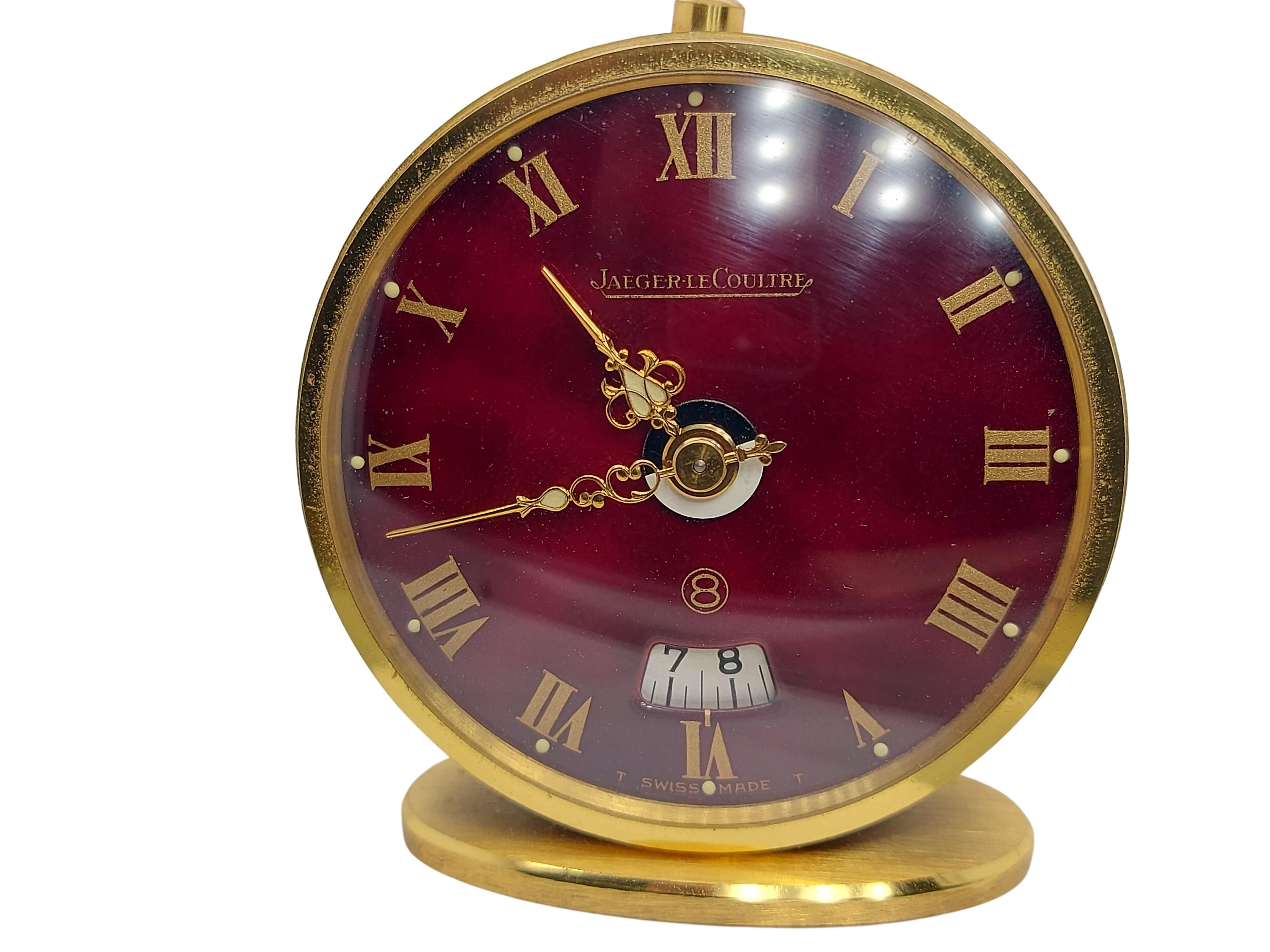 Travel Alarm Clock, Jaeger Le Coultre Reveil Rouge 8 Jours With Box and Papers from Old Stock !

Case: Material gold plated, Width 46mm, Length 50.5 mm, Thickness 28mm

Dial: Red dial, Gold Roman Numerals, Gold indexes, Date window

Total weight: