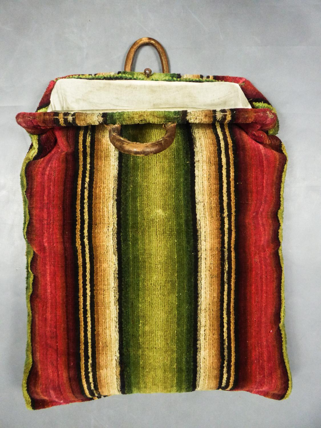 Late 18 th century
France

Rare Large wool tapestry travel bag dating from the 18th century. White calf skin covered with an embroidered and knotted wool tapestry, then cut to give the effect of velvet. Beautiful shades of red, green, cream and