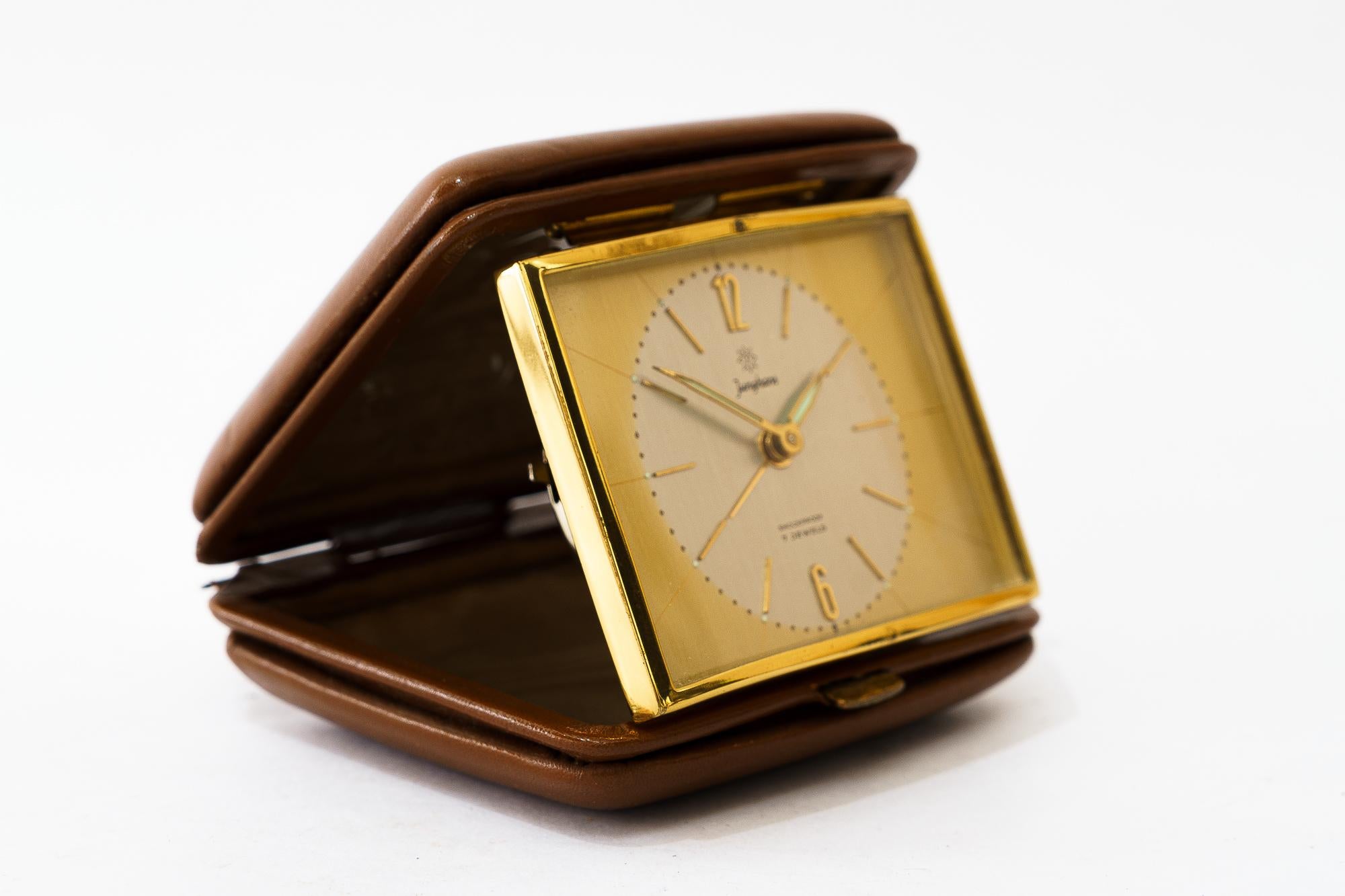 Travel alarm clock by Junghans, circa 1960s
Original condition
Brass with braun leather cover
Still working
Measures: Open height 7,5cm, wide 9cm, deep 8cm
Closed height 2,5cm, wide 9cm, deep 8cm.