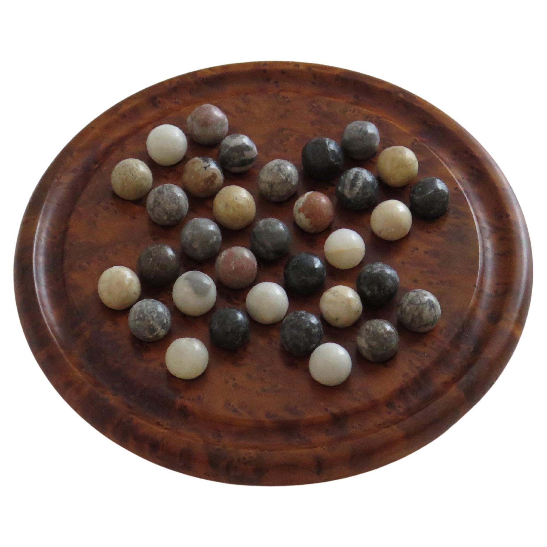 Marble Solitaire Game with hardwood board and 33 agate stone Marbles, Circa 1925